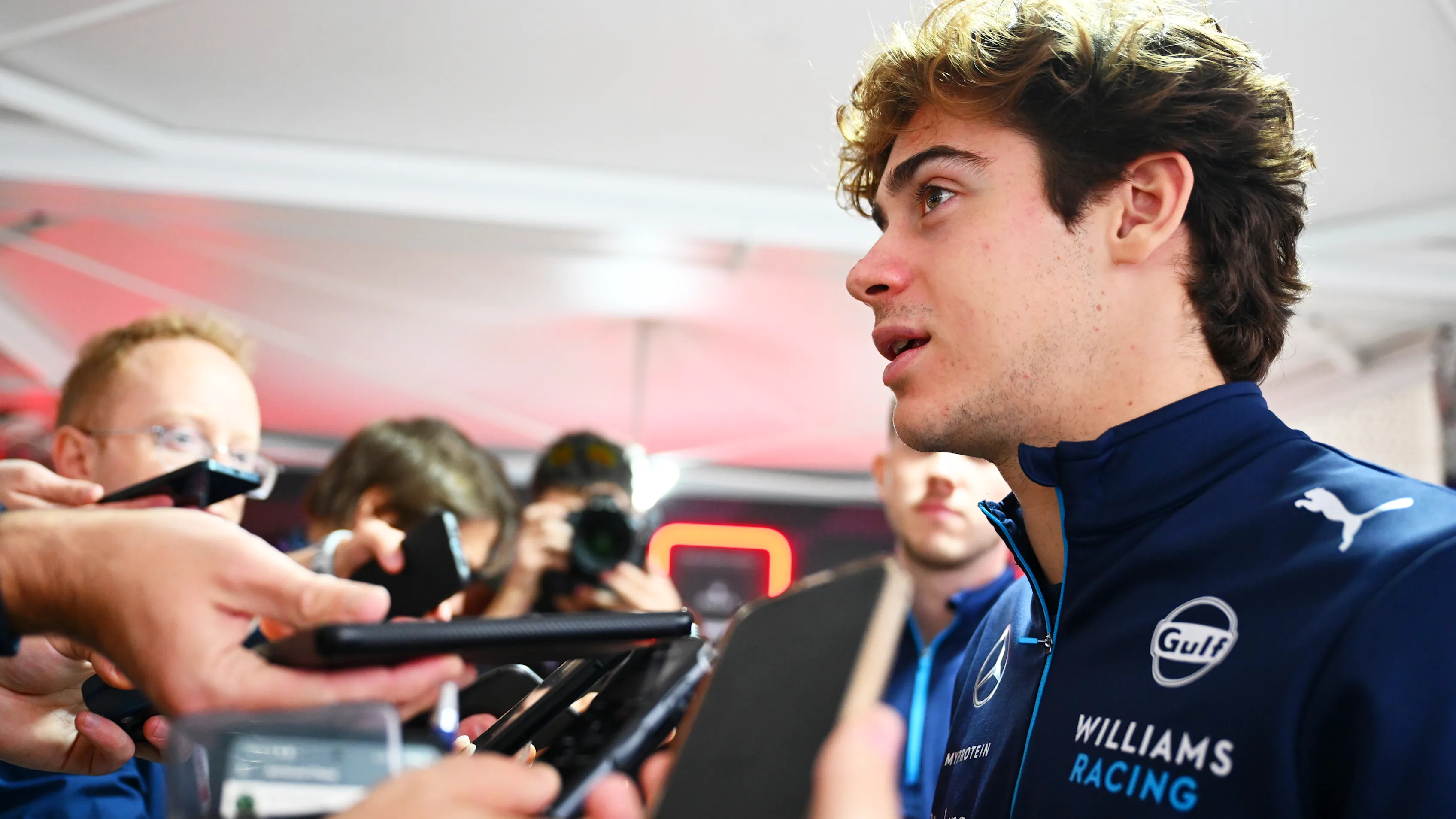 LUSAIL CITY, QATAR - NOVEMBER 28: Franco Colapinto of Argentina and Williams talks to the media in