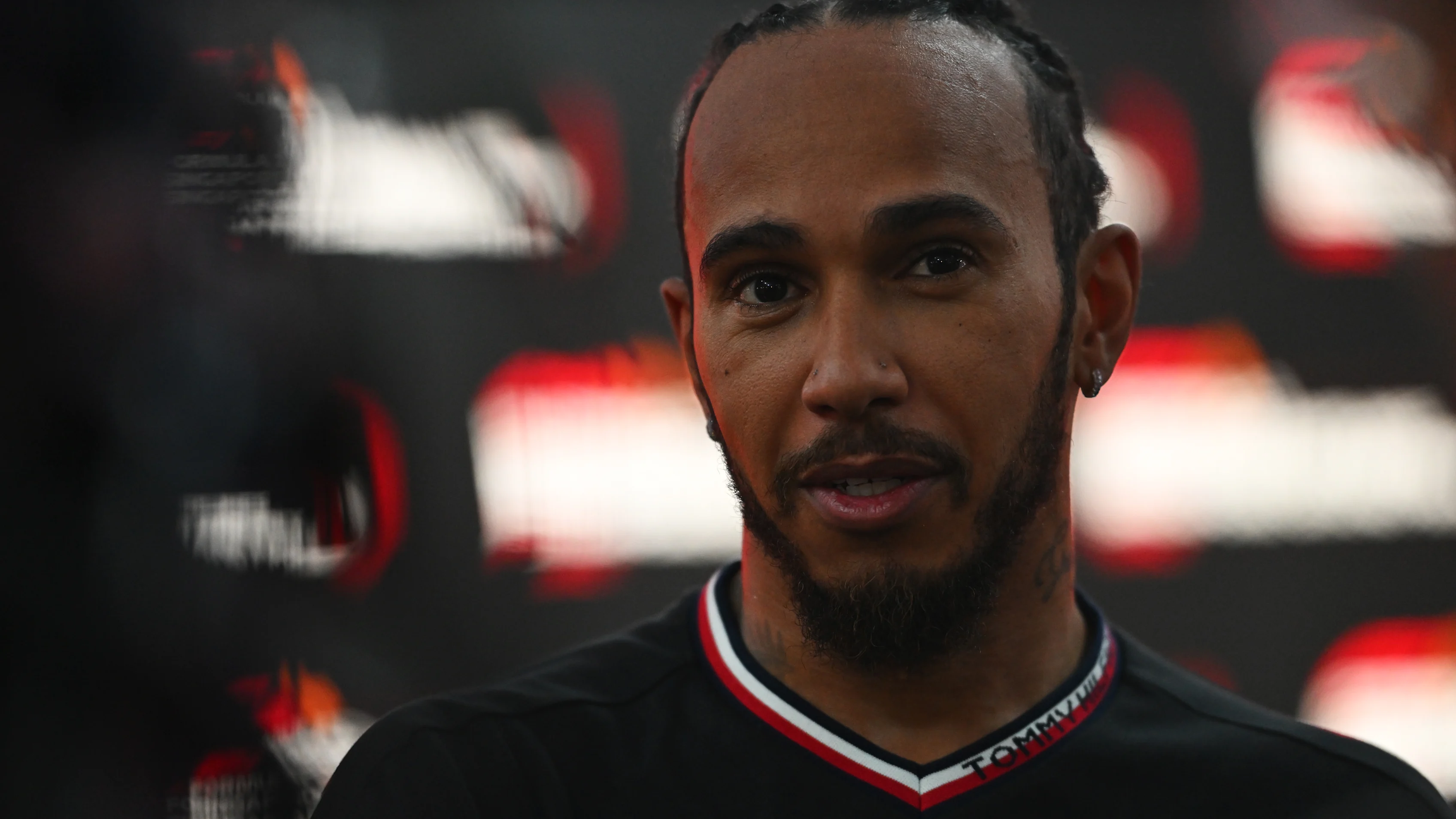 SINGAPORE, SINGAPORE - SEPTEMBER 20: Lewis Hamilton of Great Britain and Mercedes talks to the
