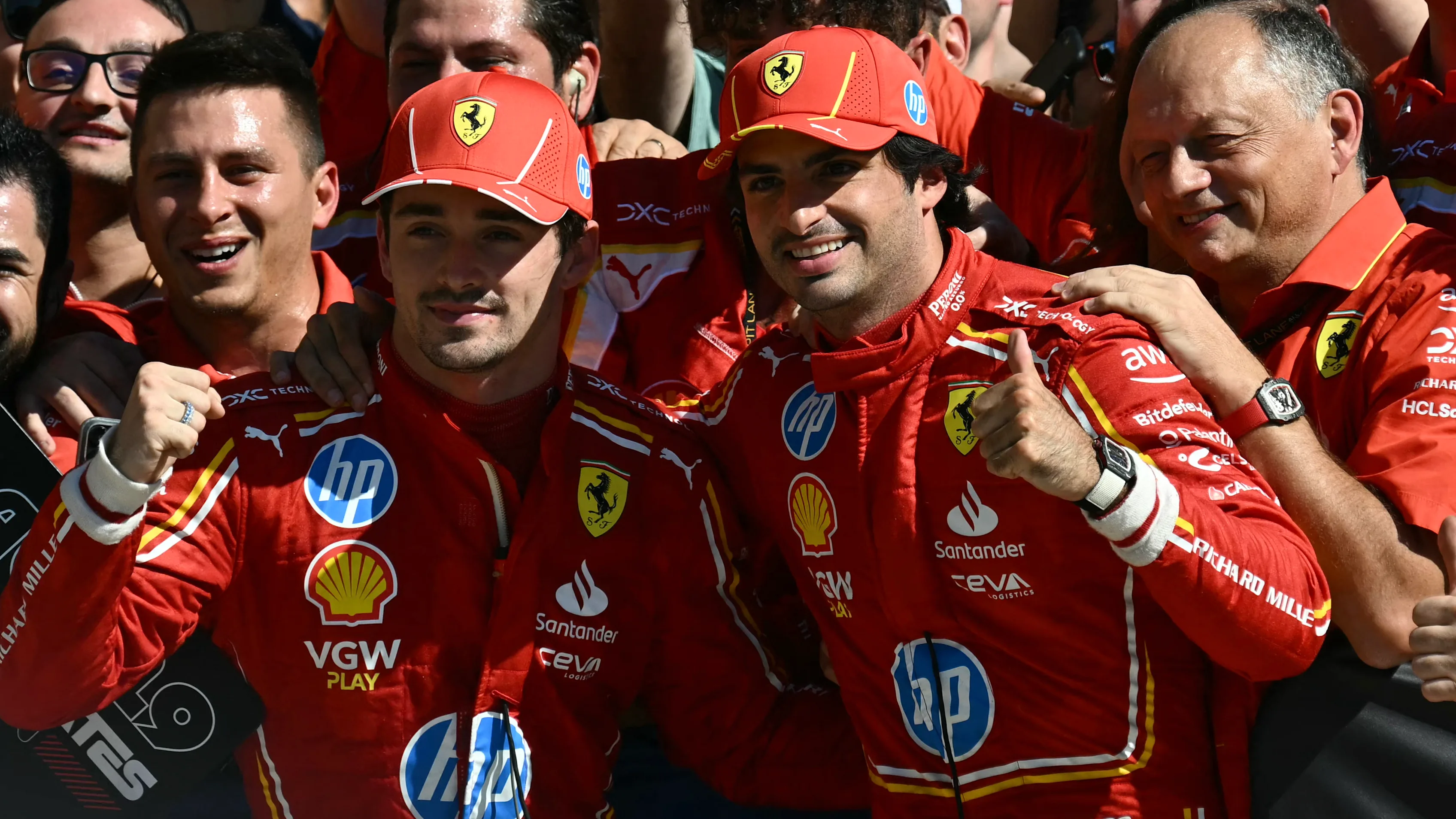 (L-R) Ferrari's Monegasque driver Charles Leclerc, Ferrari's Spanish driver Carlos Sainz Jr. and