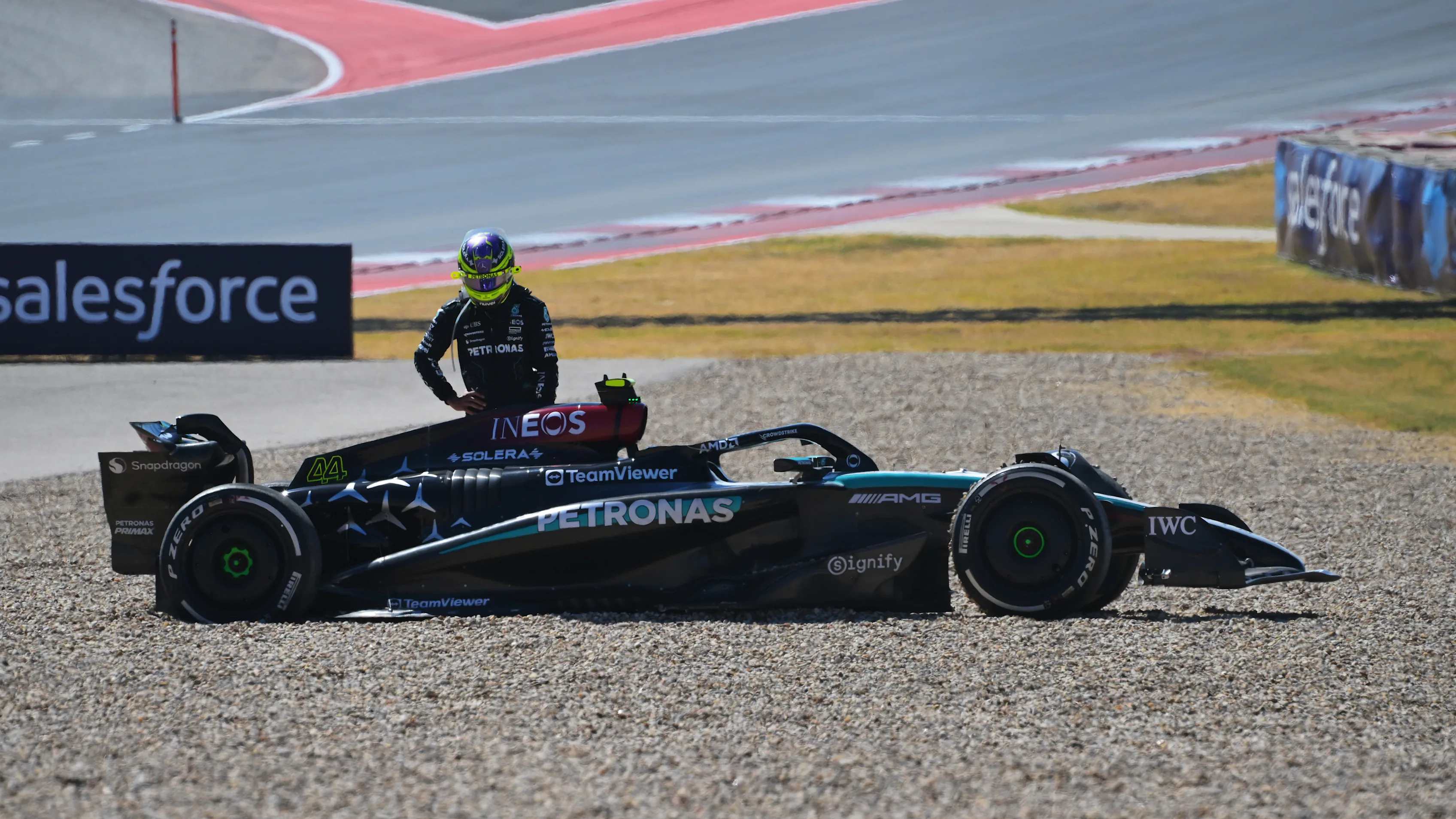 AUSTIN, TEXAS - OCTOBER 20: Lewis Hamilton of Great Britain and Mercedes looks on at his W15 after