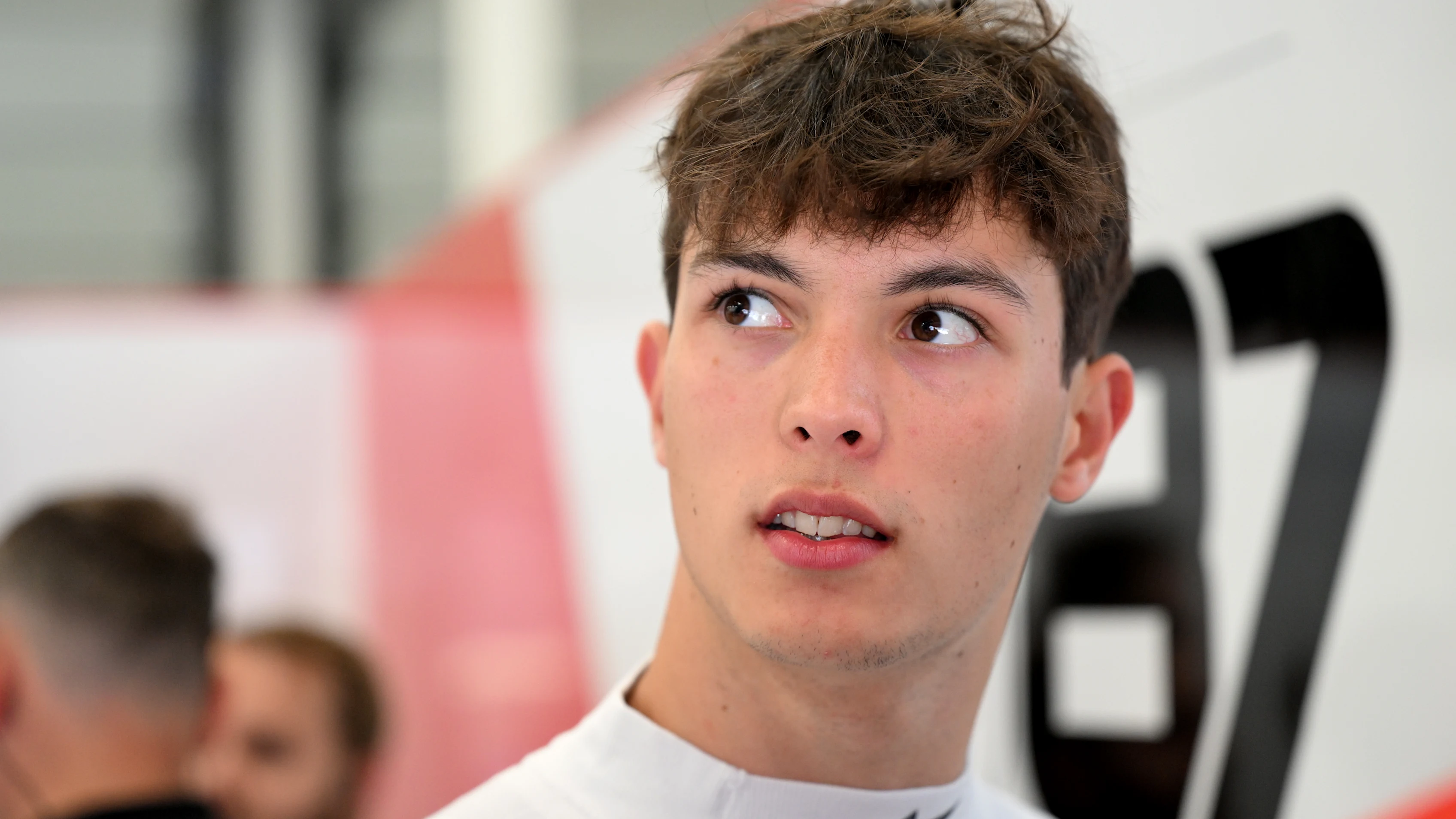 NORTHAMPTON, ENGLAND - JULY 04: Oliver Bearman of Great Britain and Haas F1 looks on in the garage