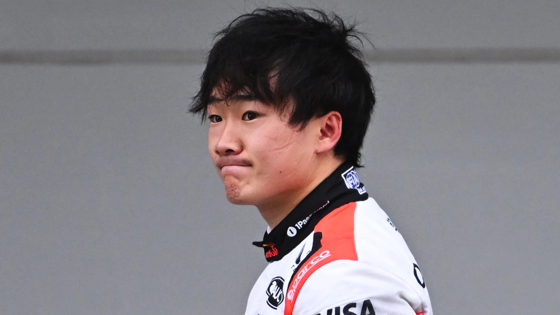 SUZUKA, JAPAN - APRIL 04: Yuki Tsunoda of Japan and Oracle Red Bull Racing looks on in the garage