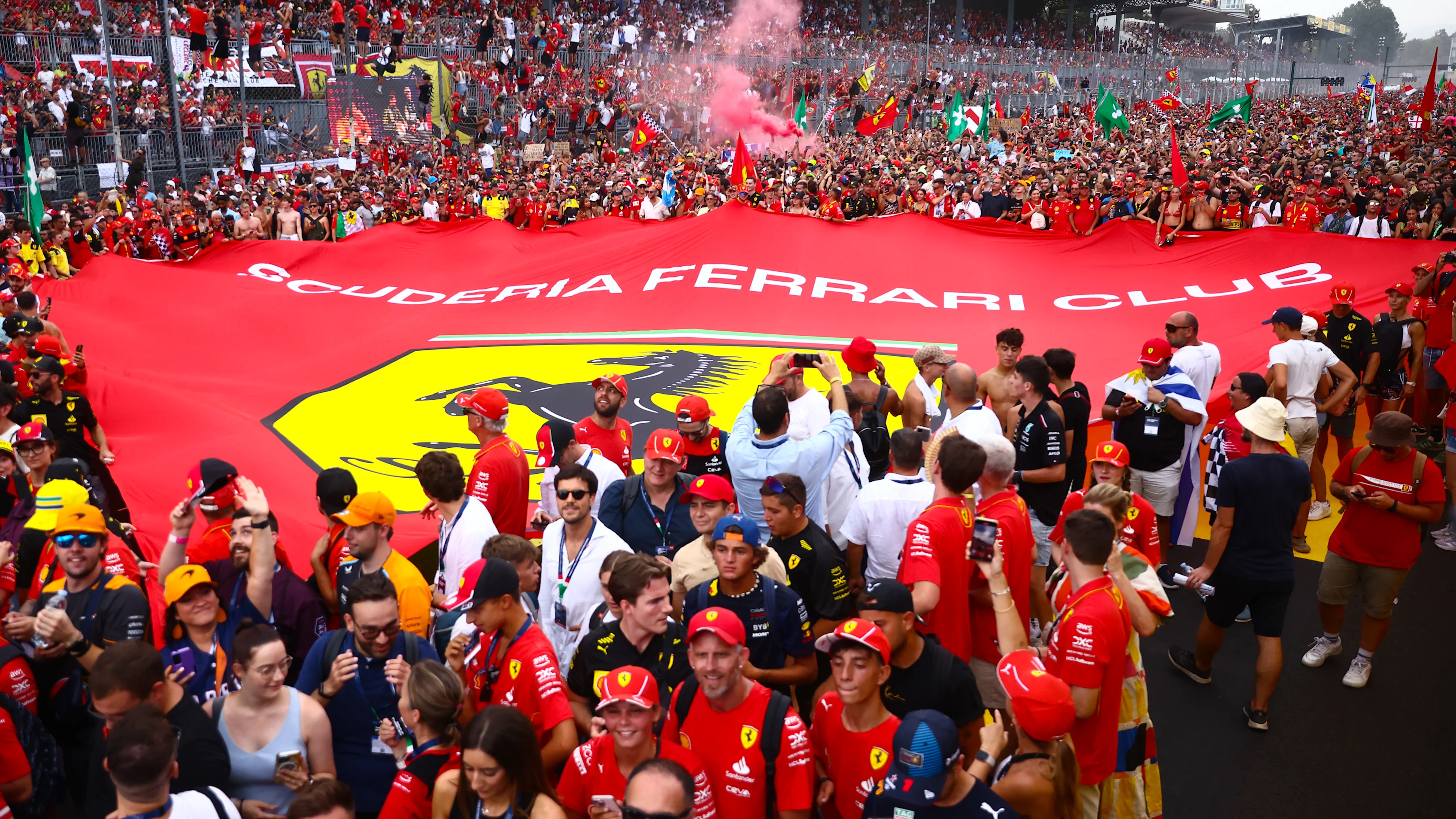 Tifosi celebrate after Charles Leclerc of Ferrari wins the Italian Formula One Grand Prix at