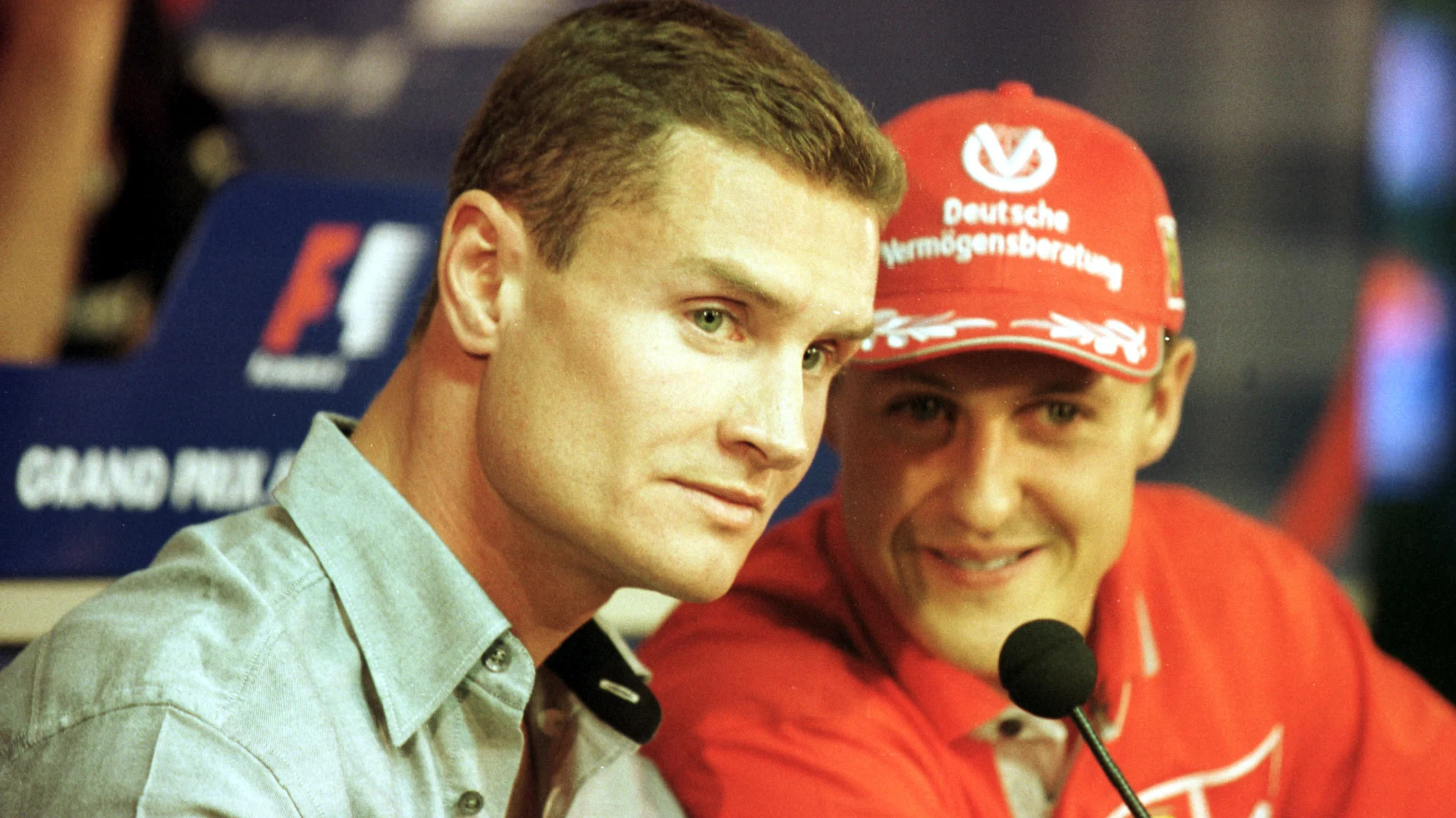 7 June 2001:   David Coulthard (left) and Michael Schumacher (centre) discuss how Arrows driver
