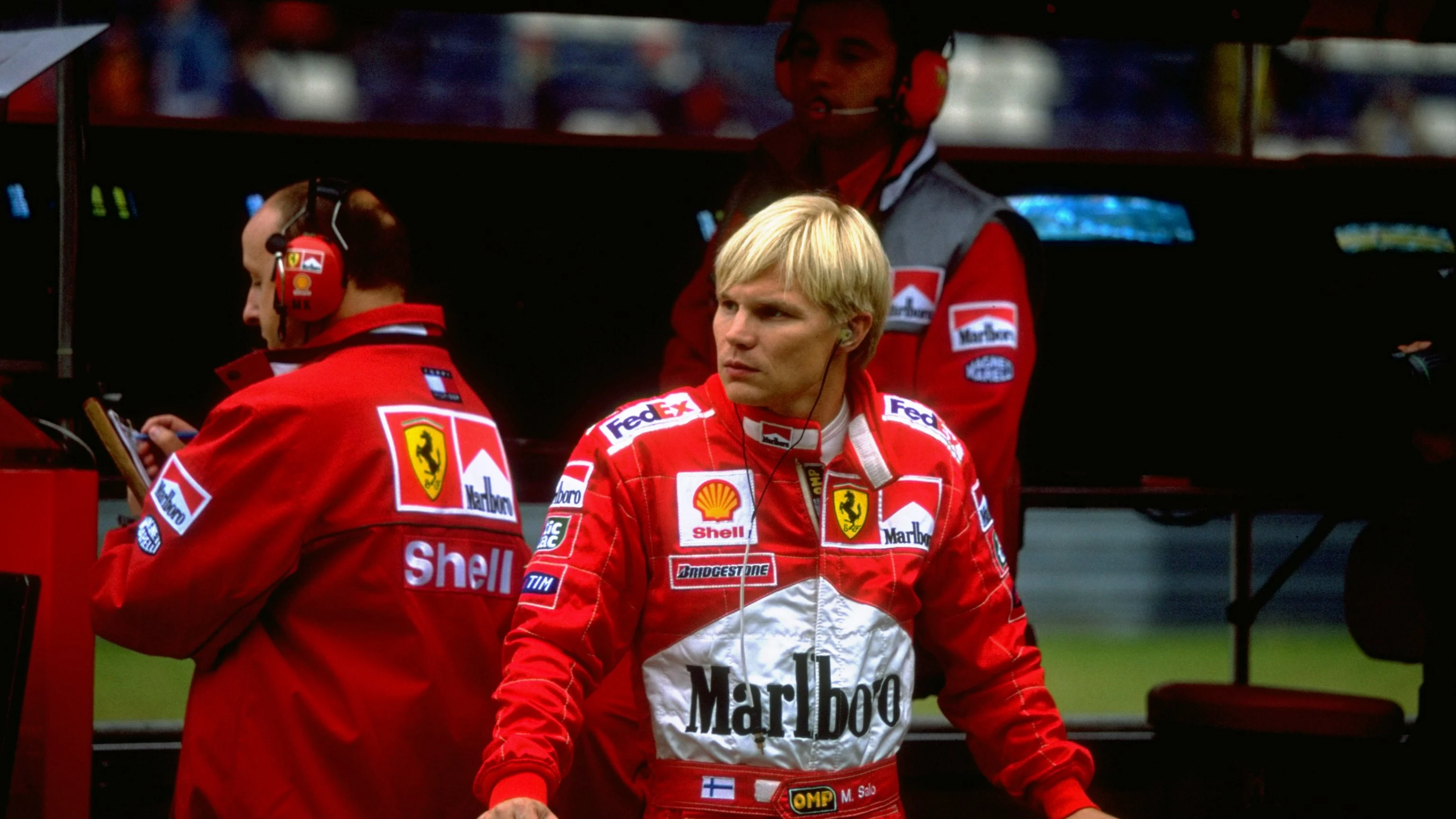26 Sep 1999:  Mika Salo of Finland stands in the Ferrari pits before the European Grand Prix held