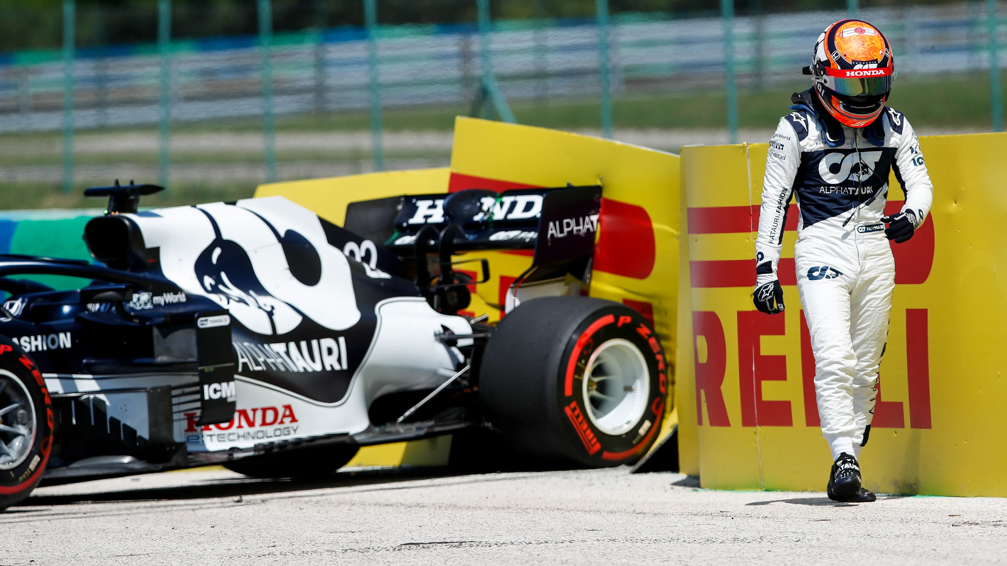 HUNGARORING, HUNGARY - JULY 30: Yuki Tsunoda, AlphaTauri, walks away from his car after spinning