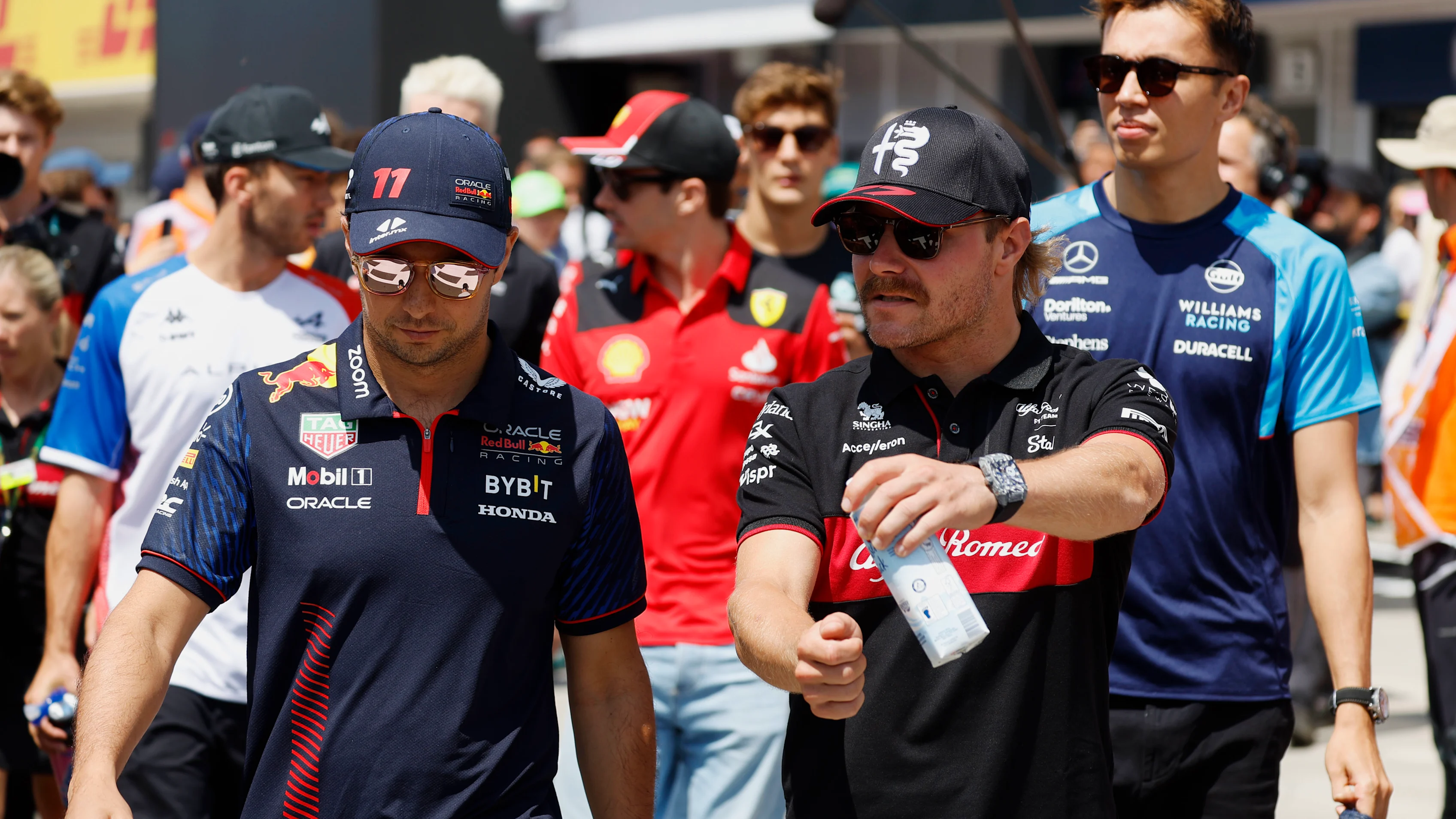 HUNGARORING, HUNGARY - JULY 23: Sergio Perez, Red Bull Racing, with Valtteri Bottas, Alfa Romeo F1