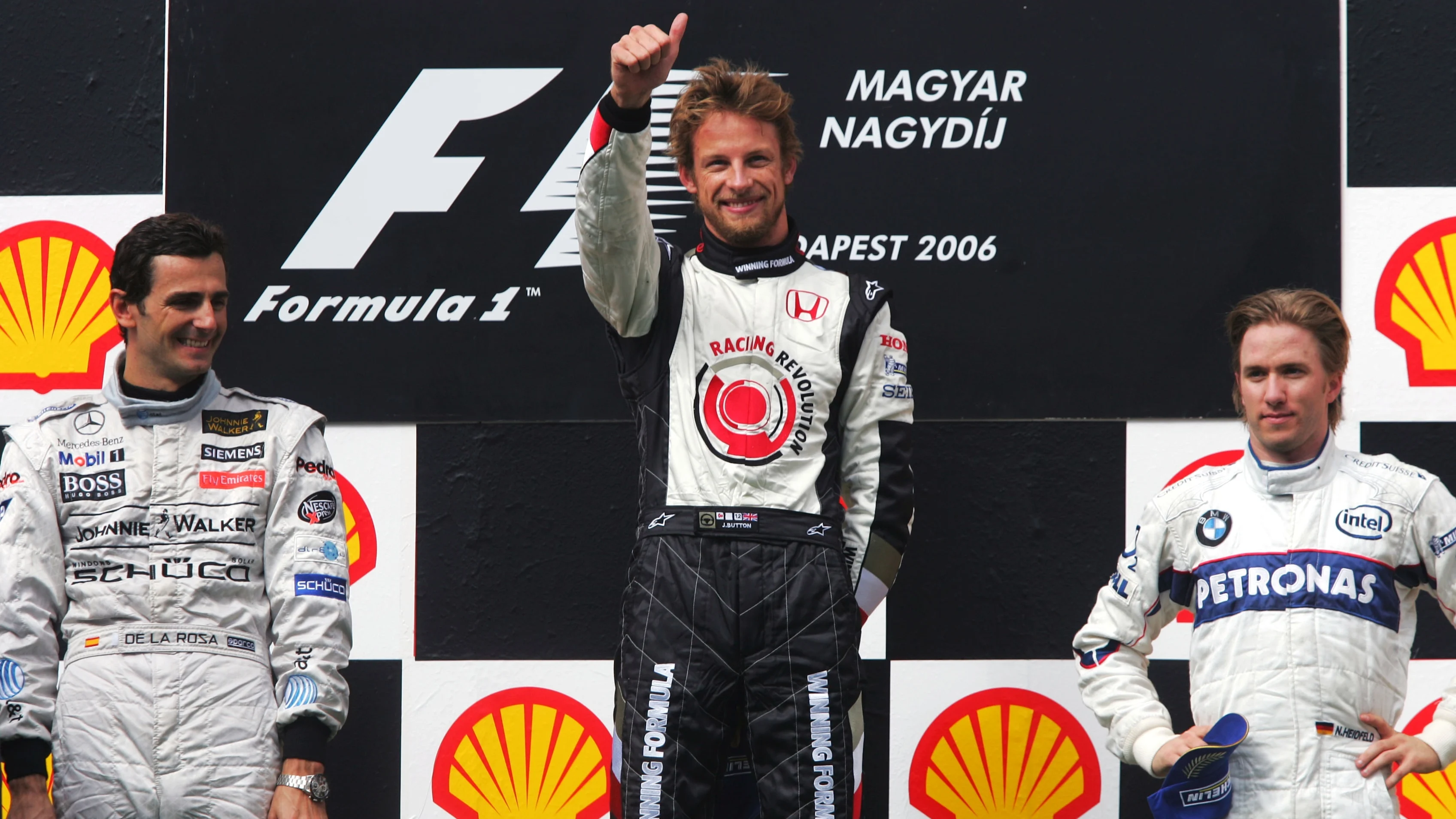 Podium (L to R): Second place Pedro de la Rosa (ESP) McLaren, race winner Jenson Button (GBR) Honda