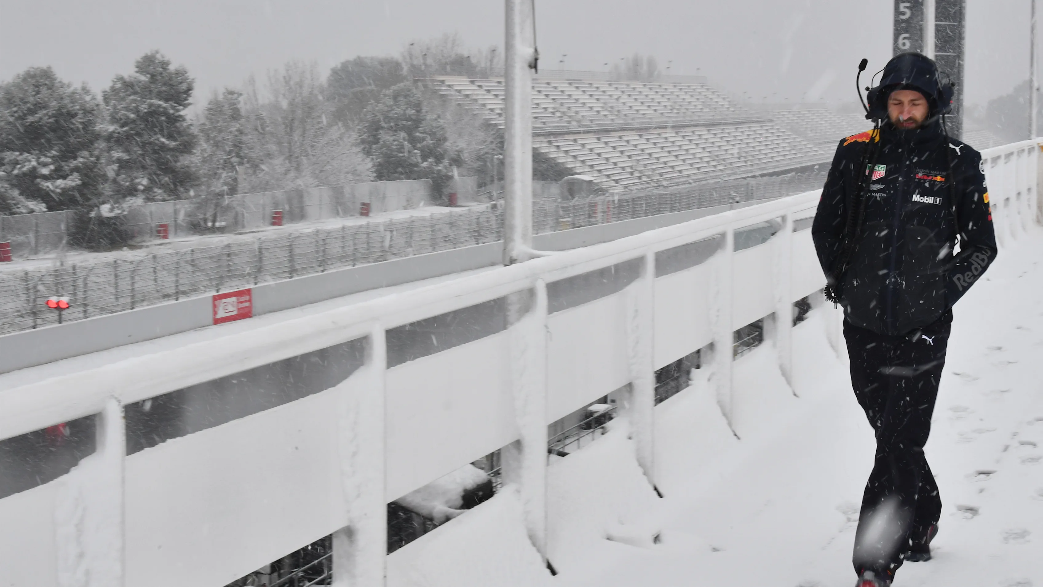 Red Bull Racing mechanic as snow stops testing on day three at Formula One Testing, Day Three,