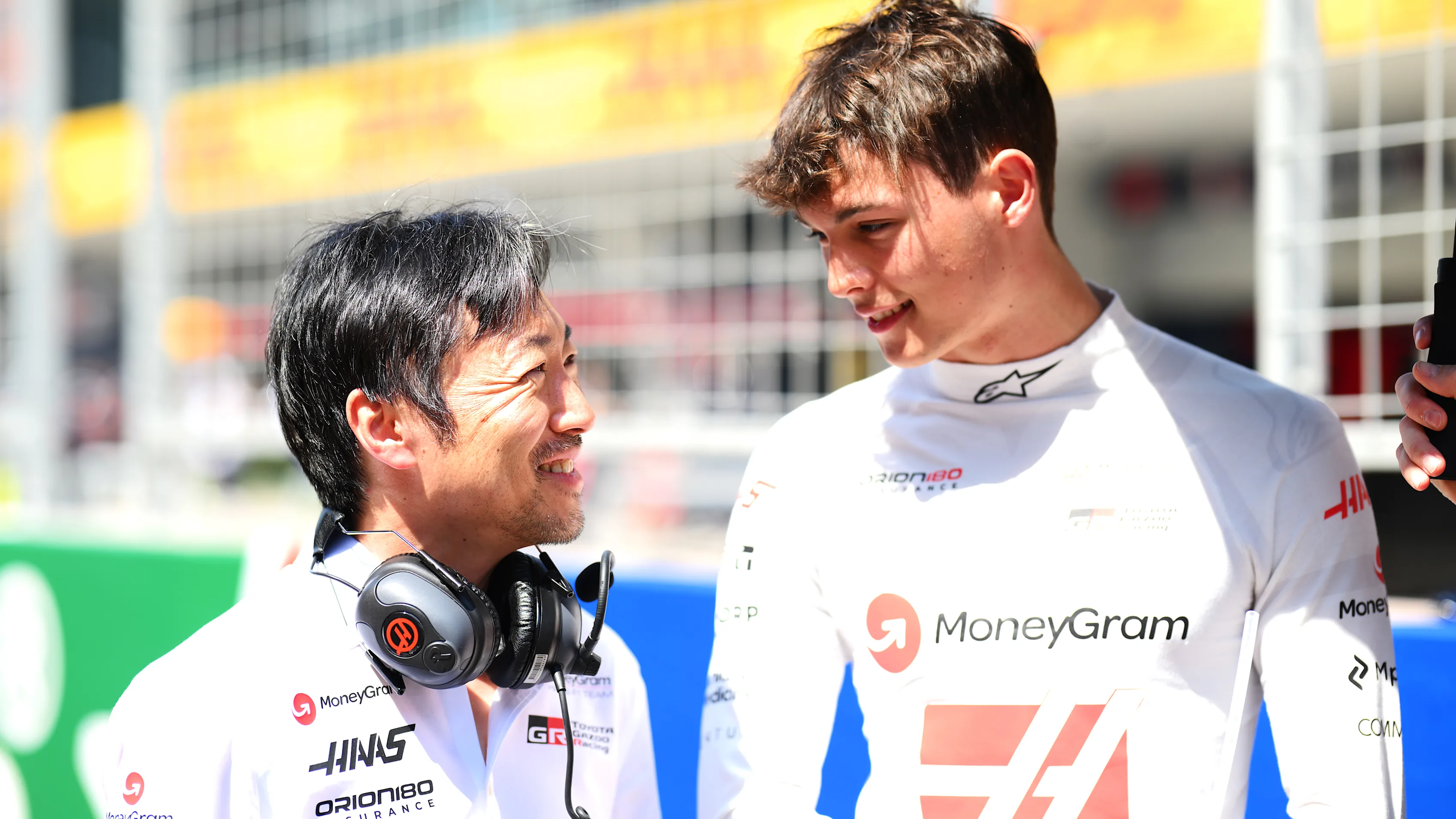 SHANGHAI, CHINA - MARCH 22: Ayao Komatsu, Team Principal of Haas F1 and Oliver Bearman of Great