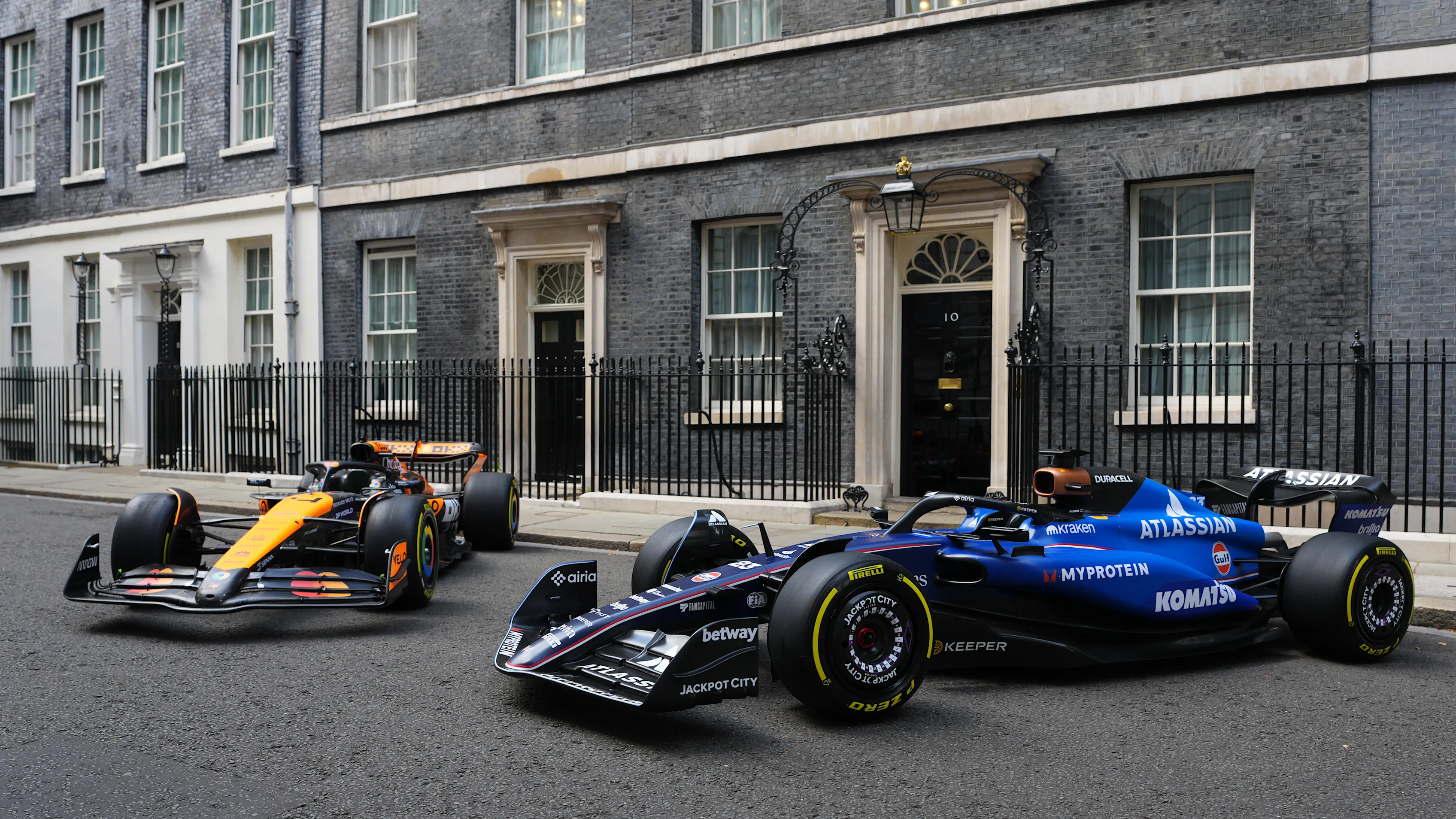 LONDON, ENGLAND - JULY 2: (L-R) McLaren Mercedes and Williams Mercedes Formula One cars sit outside