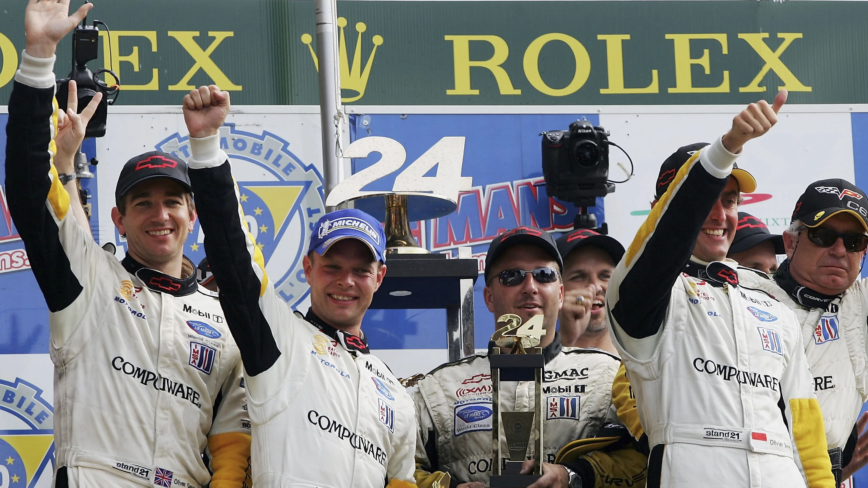 LE MANS, FRANCE - JUNE 18:  LMGT1 class winners (L-R) Oliver Gavin, Jan Magnussen and Oliver
