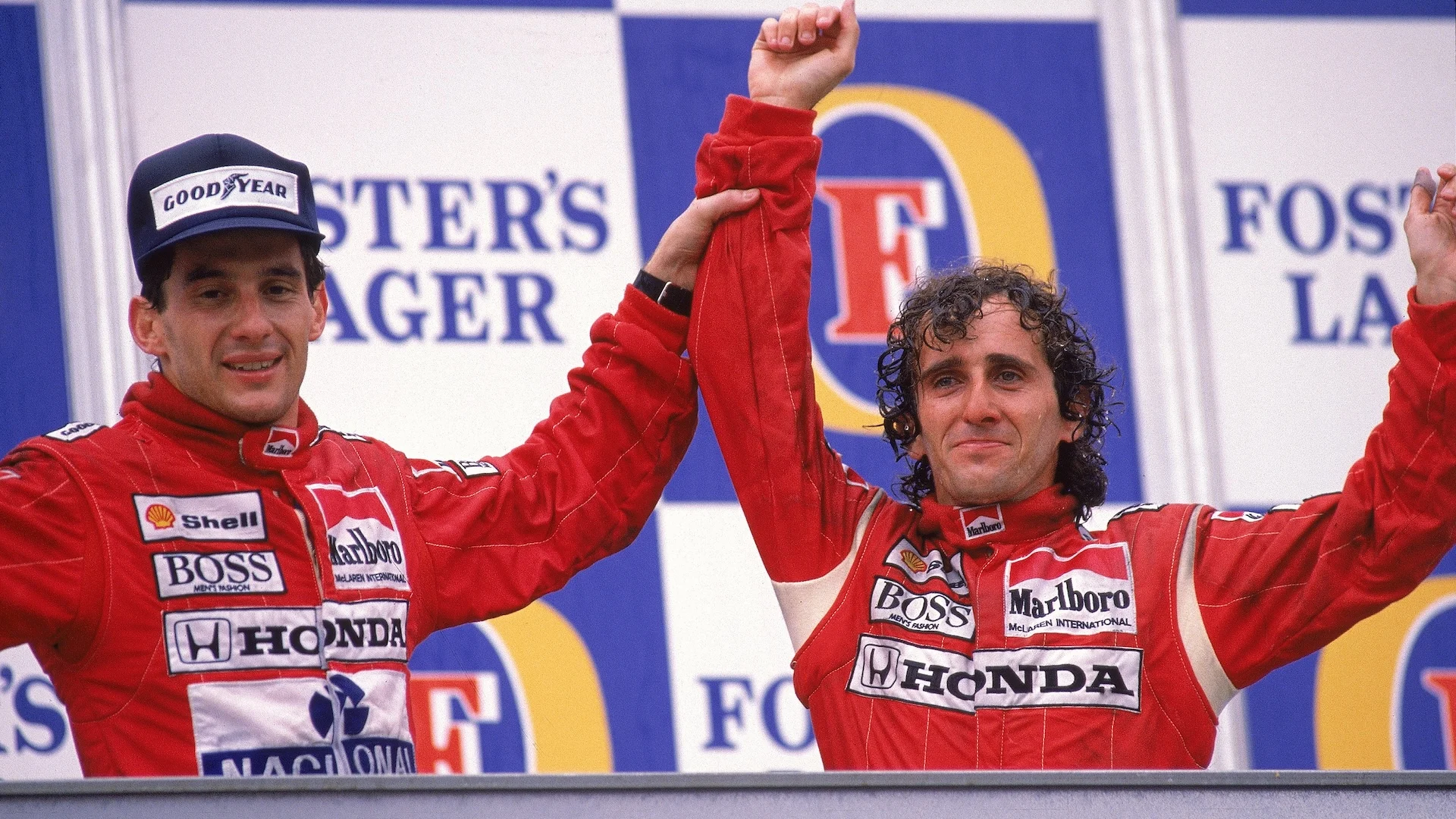 13 Nov 1988:  McLaren Honda driver Alain Prost of France celebrates his victory with team-mate