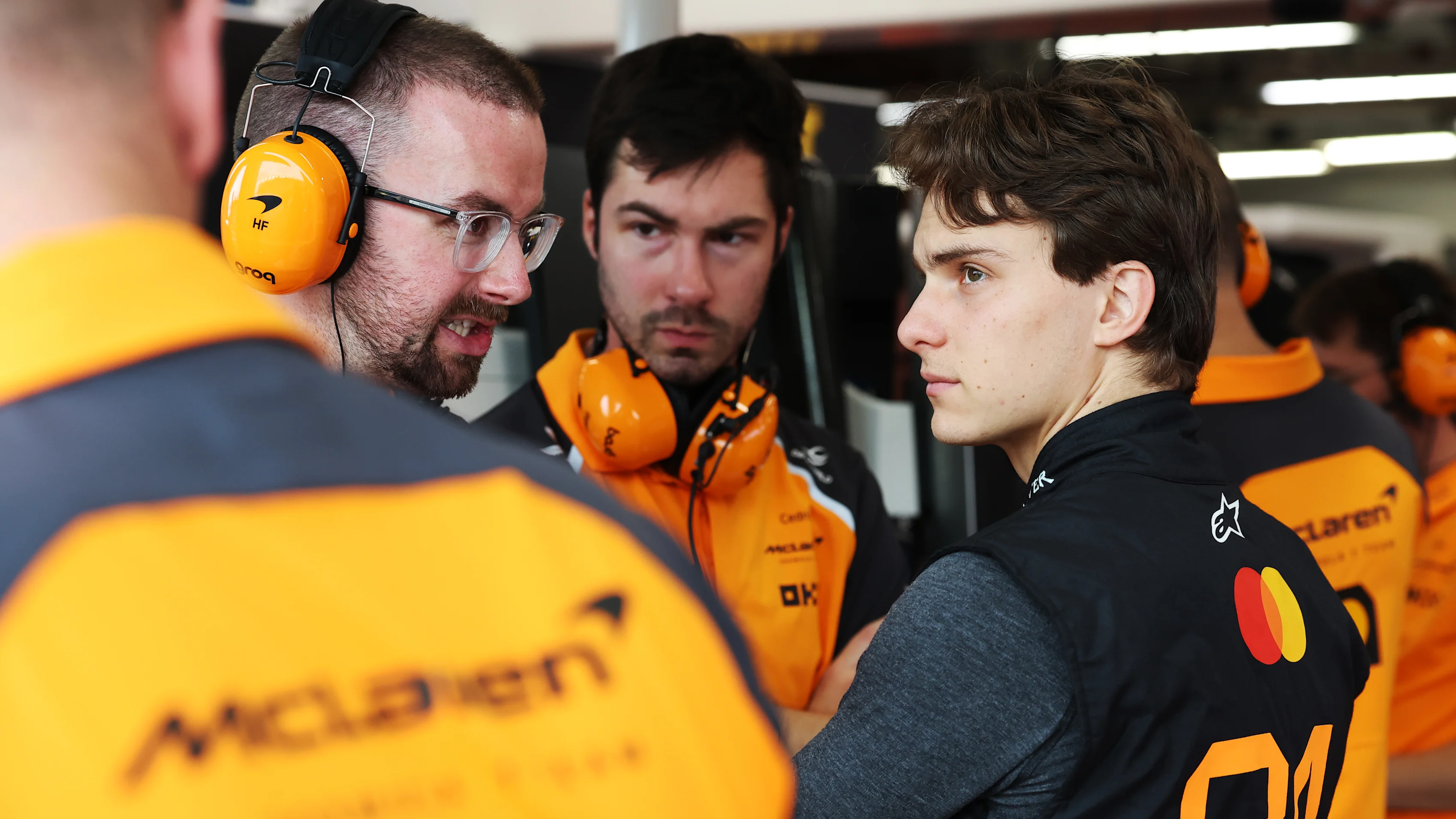 SINGAPORE, SINGAPORE - OCTOBER 03: Oscar Piastri of Australia and McLaren looks on in the garage