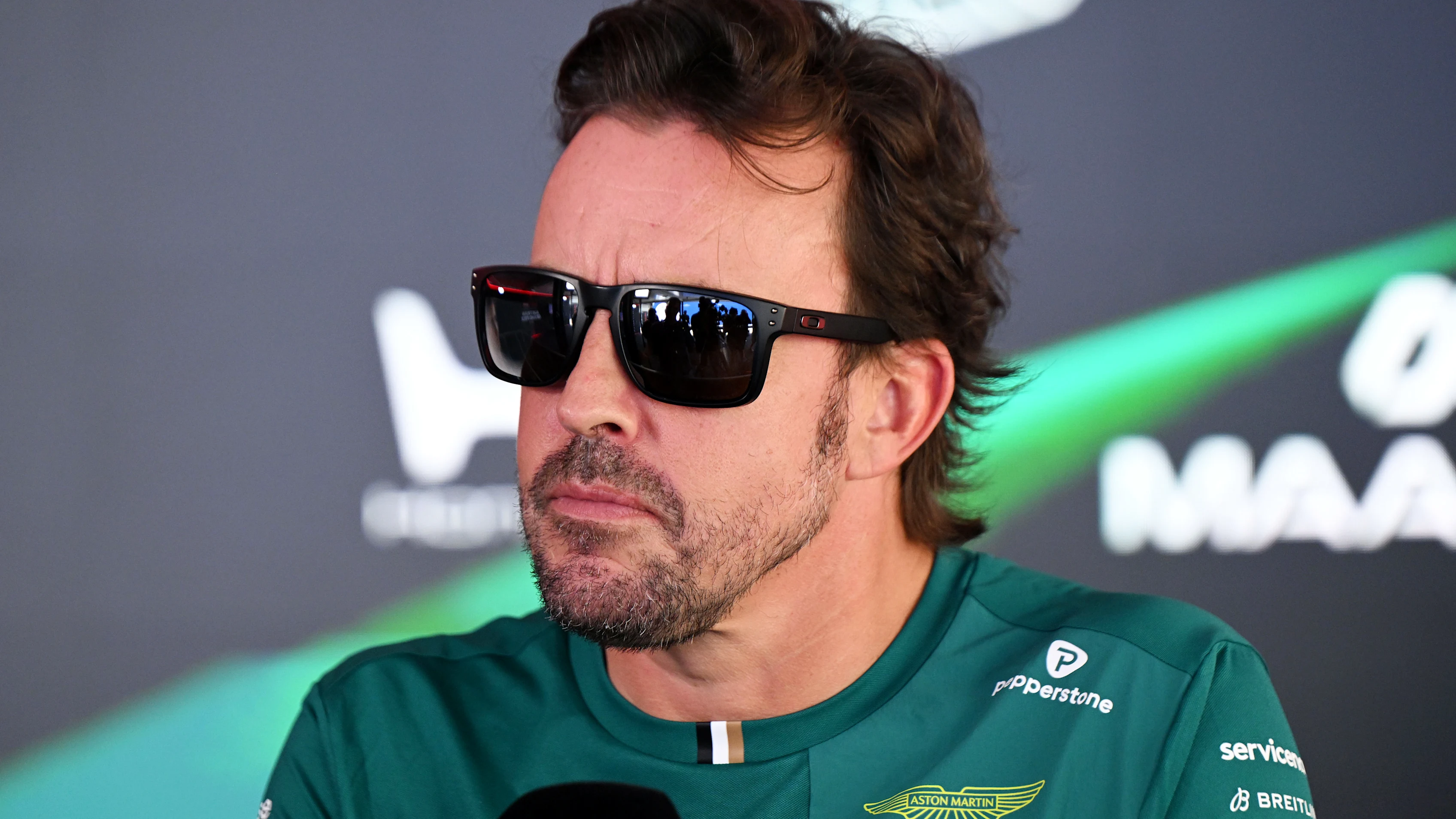 SPIELBERG, AUSTRIA - JUNE 25: Fernando Alonso of Spain and Aston Martin F1 Team talks to the media