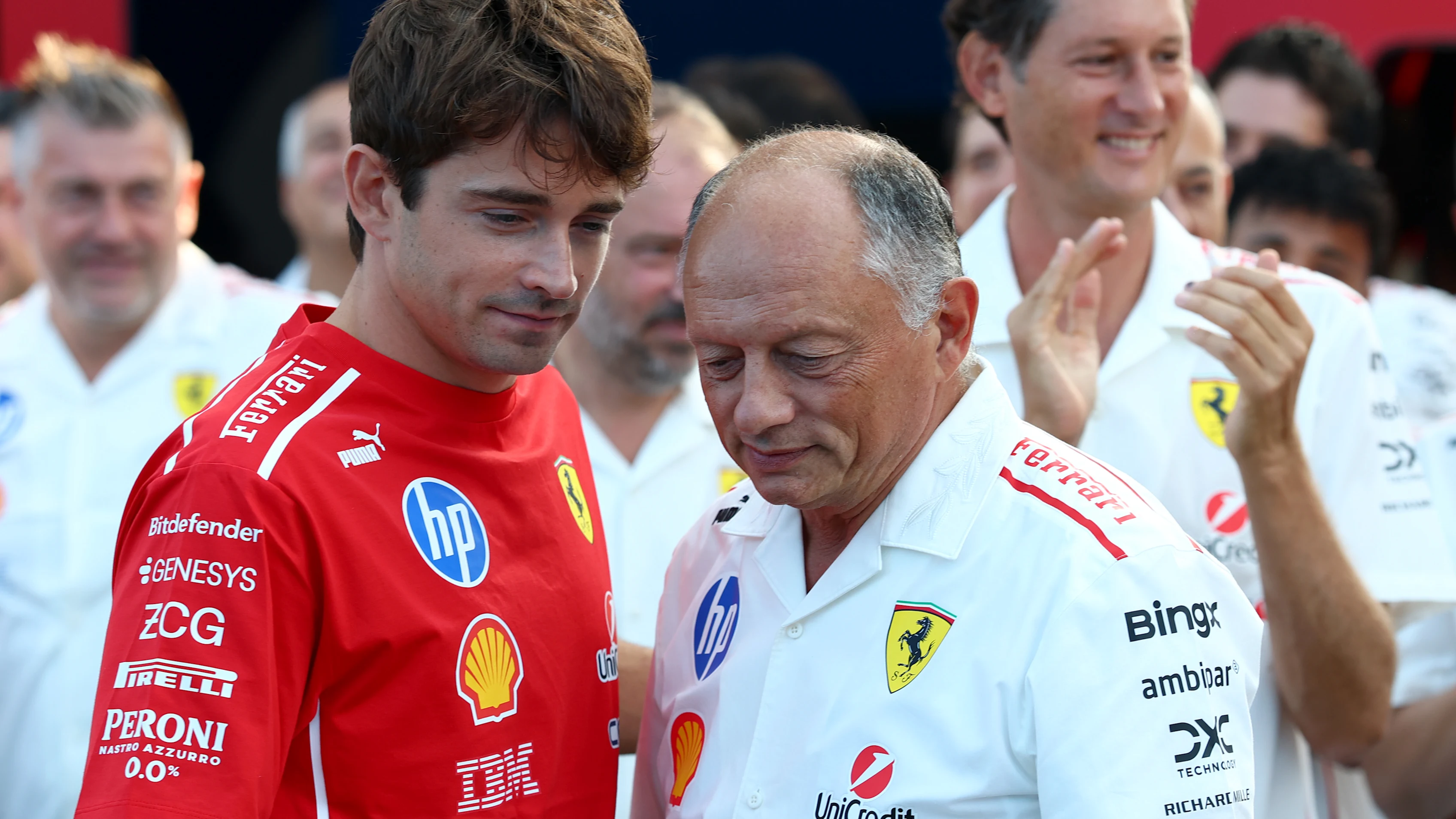 MONZA, ITALY - SEPTEMBER 06: Charles Leclerc of Monaco and Scuderia Ferrari talks with Frederic