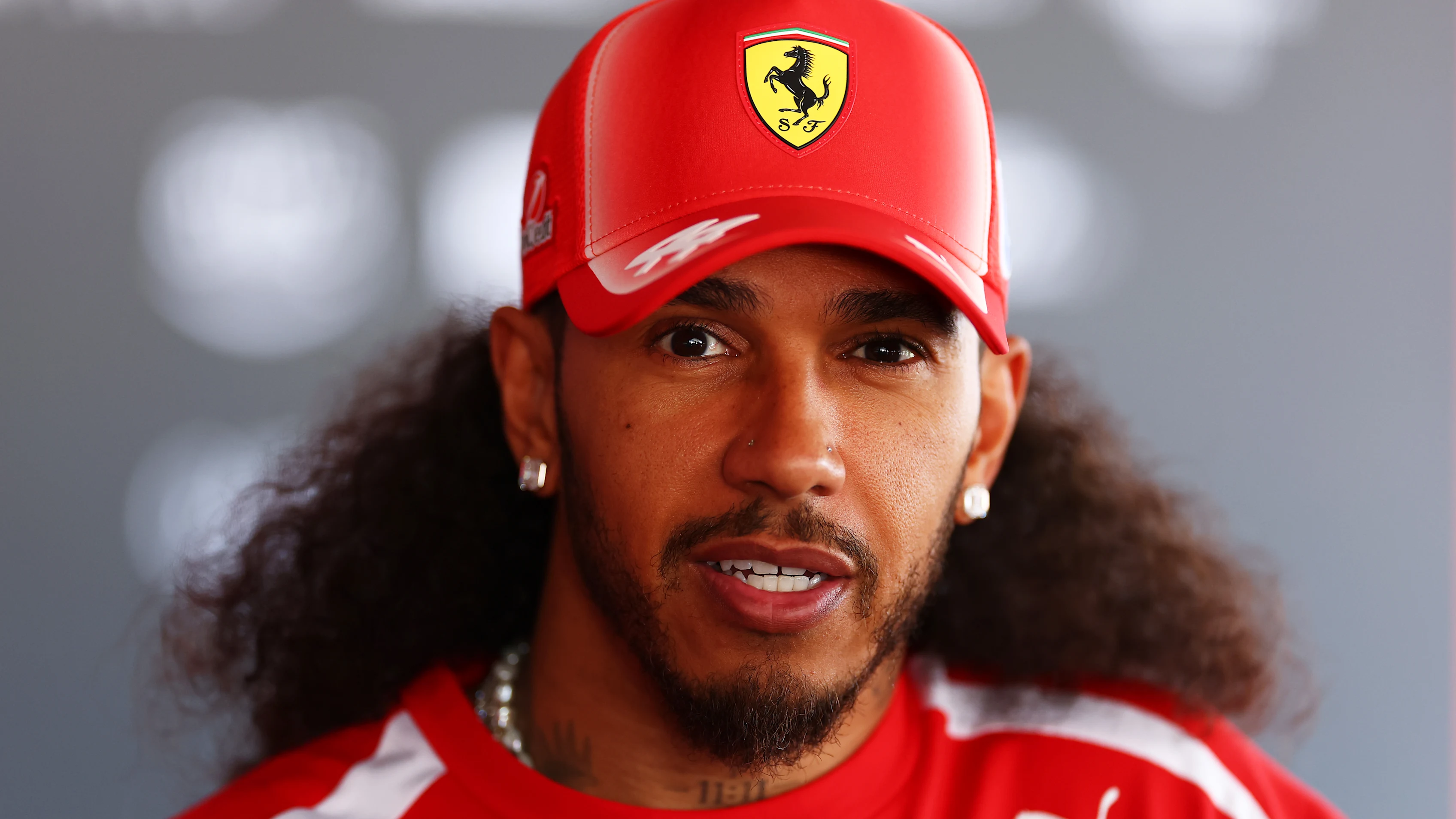 BARCELONA, SPAIN - JUNE 11: Lewis Hamilton of Great Britain and Scuderia Ferrari talks to the media