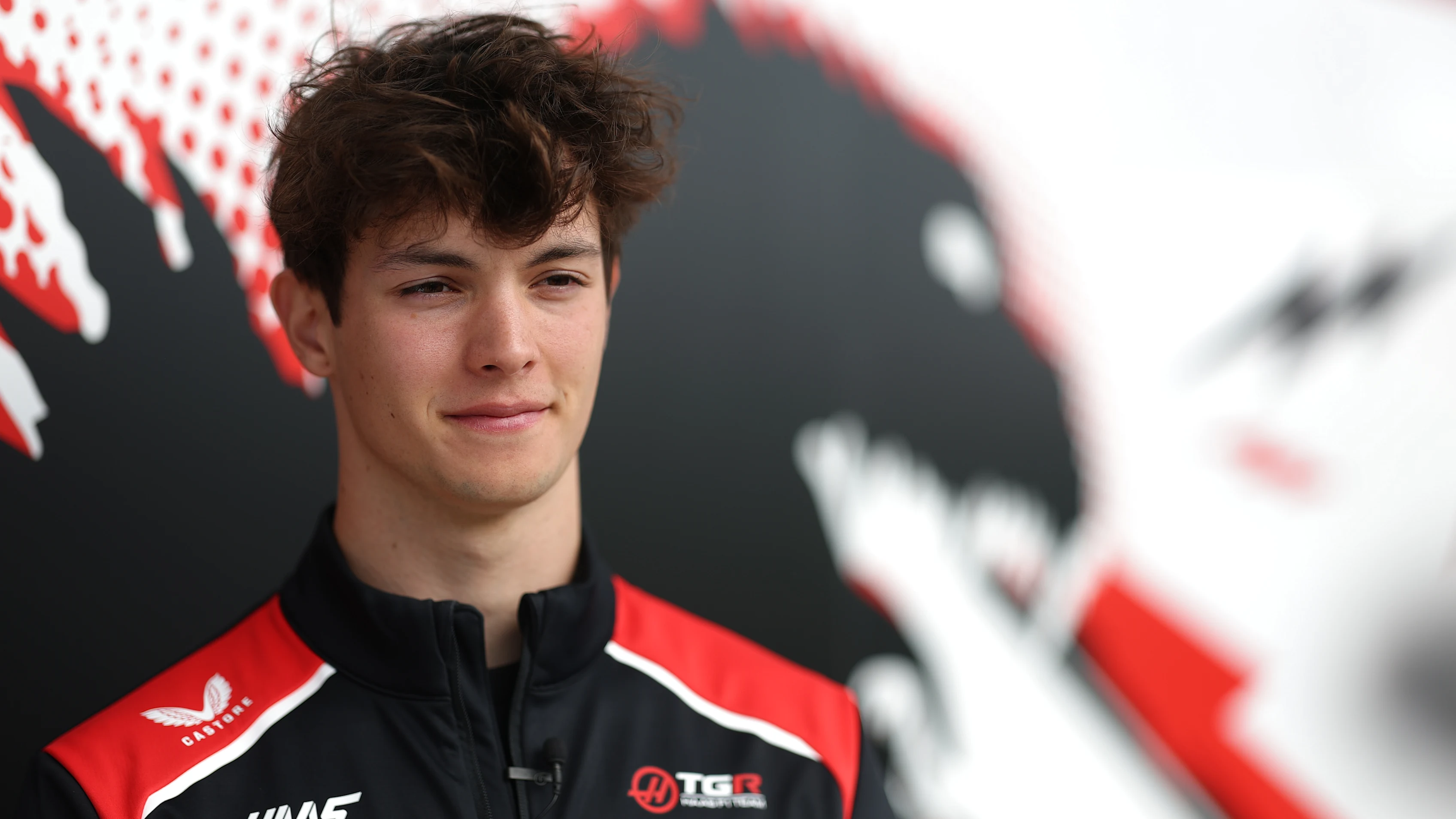 SUZUKA, JAPAN - MARCH 26: Oliver Bearman of Great Britain and Haas F1 looks on in the Paddock