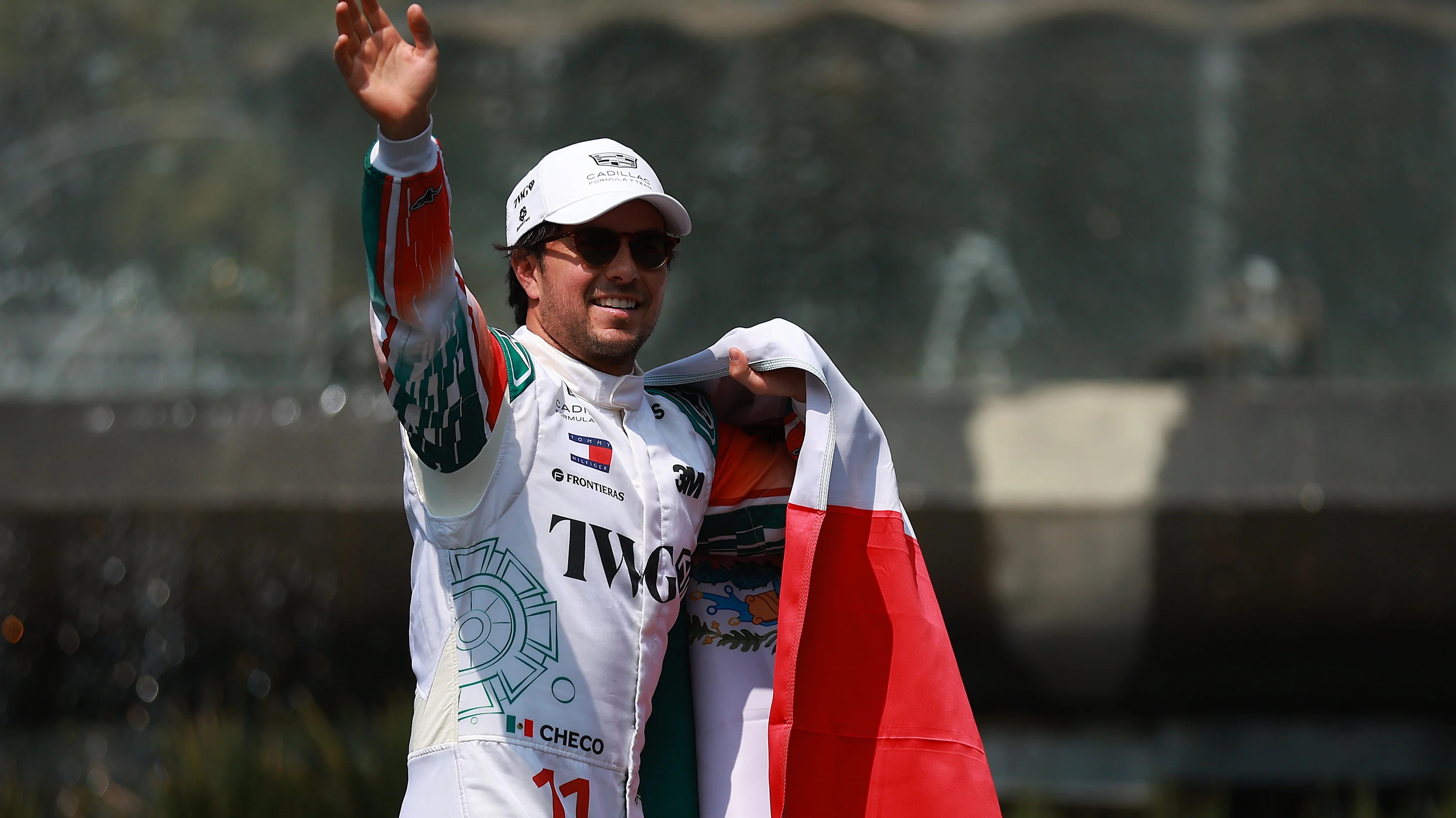 MEXICO CITY, MEXICO - OCTOBER 28: Sergio Perez of Mexico and Cadillac F1 Team salutes the fans at