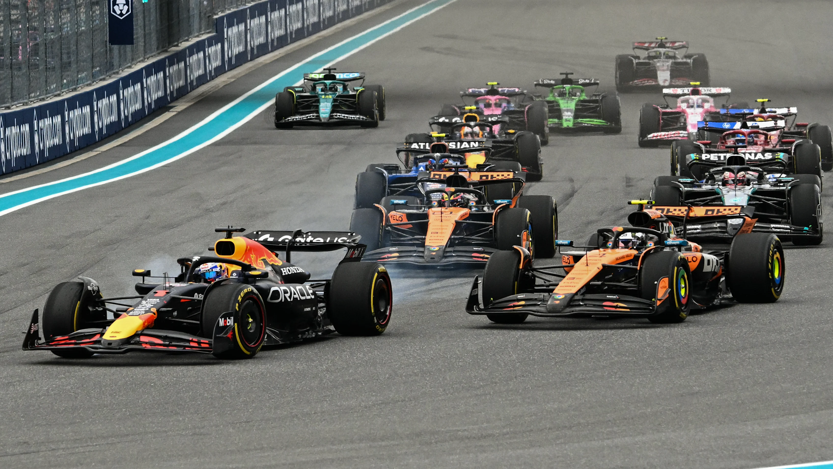 Red Bull Racing's Dutch driver Max Verstappen (L) leads the pack as the race begins during the 2025