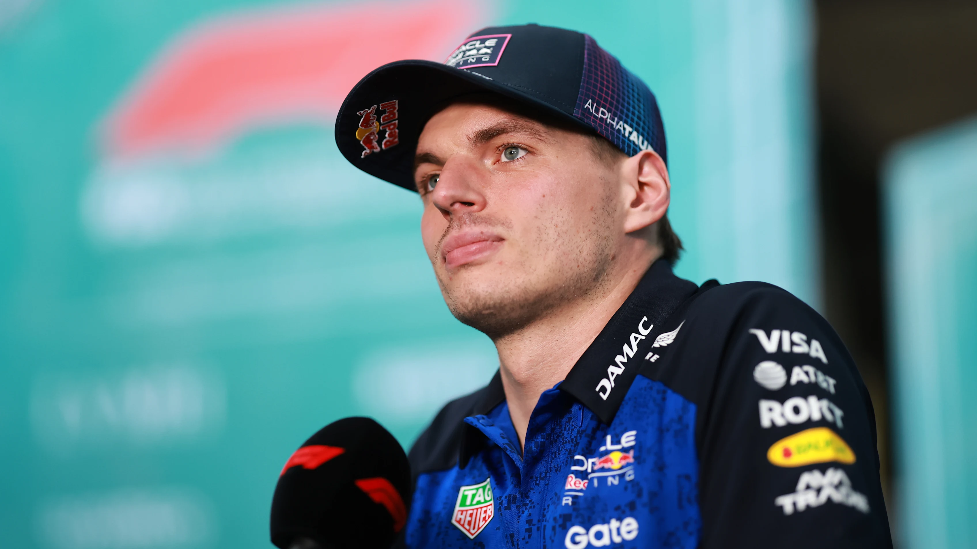 MIAMI, FLORIDA - APRIL 30: Max Verstappen of the Netherlands and Oracle Red Bull Racing talks to