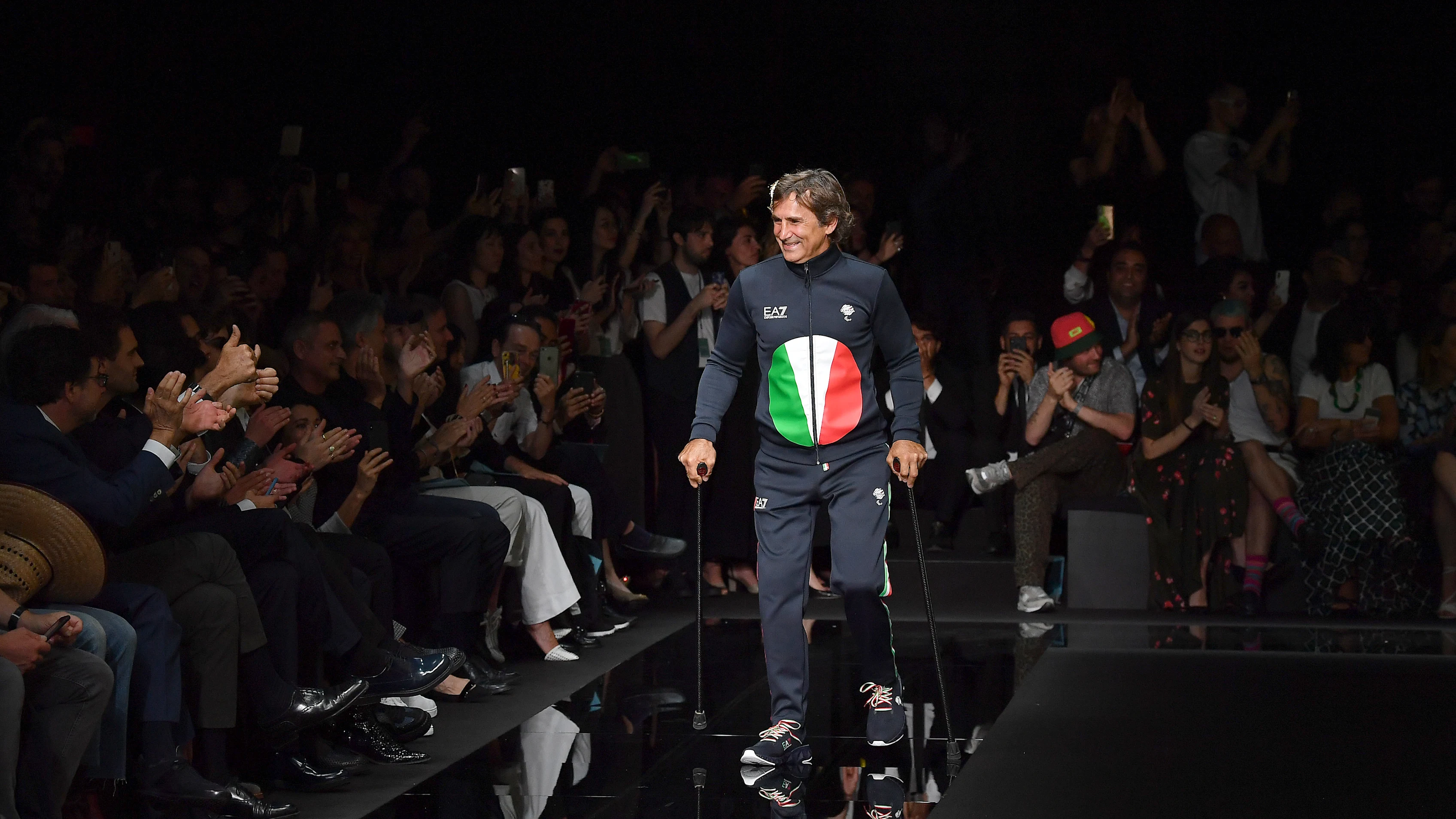 MILAN, ITALY - JUNE 15: Alex Zanardi walks the runway at the Emporio Armani fashion show during the