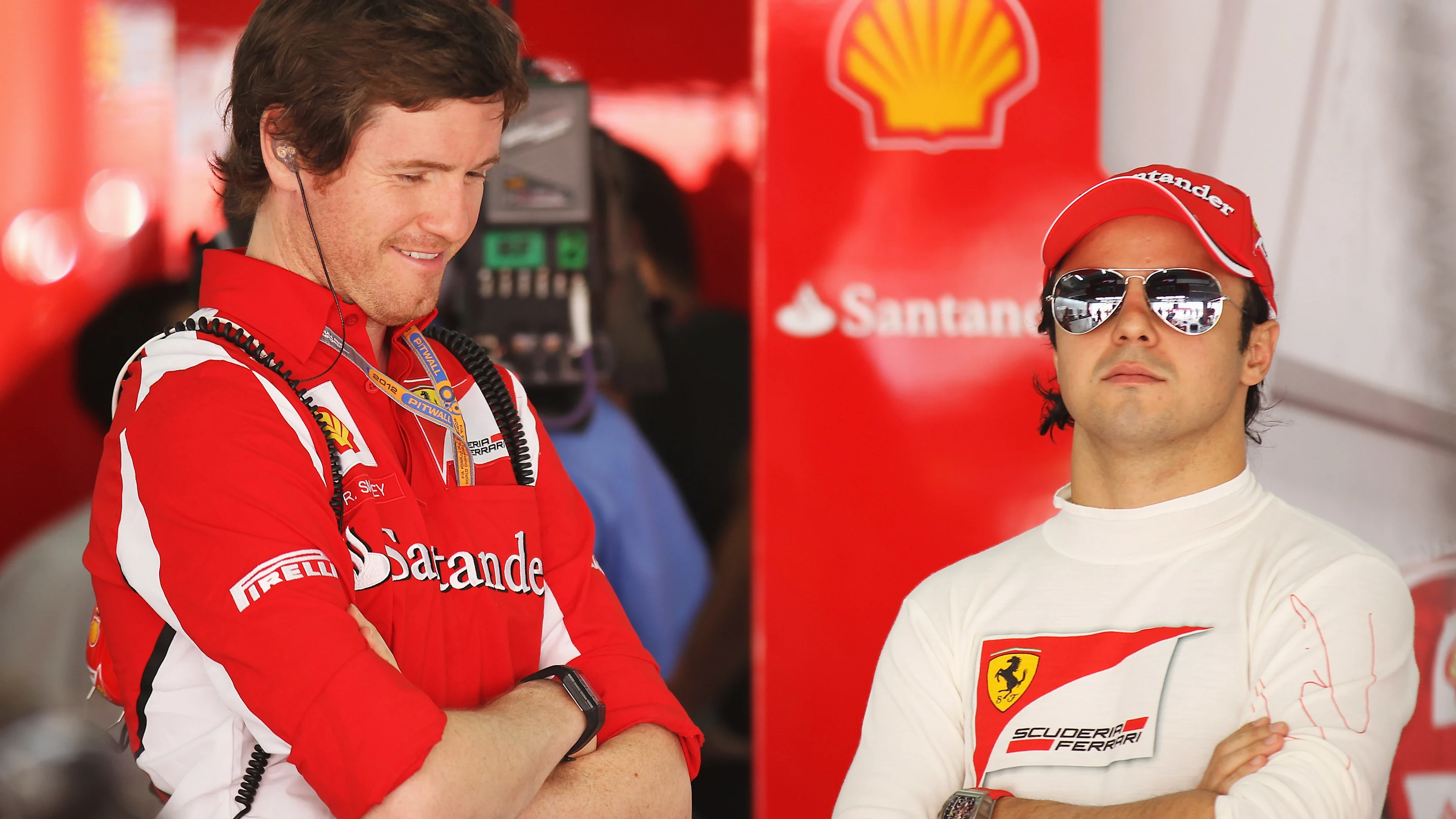 SAKHIR, BAHRAIN - APRIL 20: Felipe Massa (R) of Brazil and Ferrari talks with his race engineer
