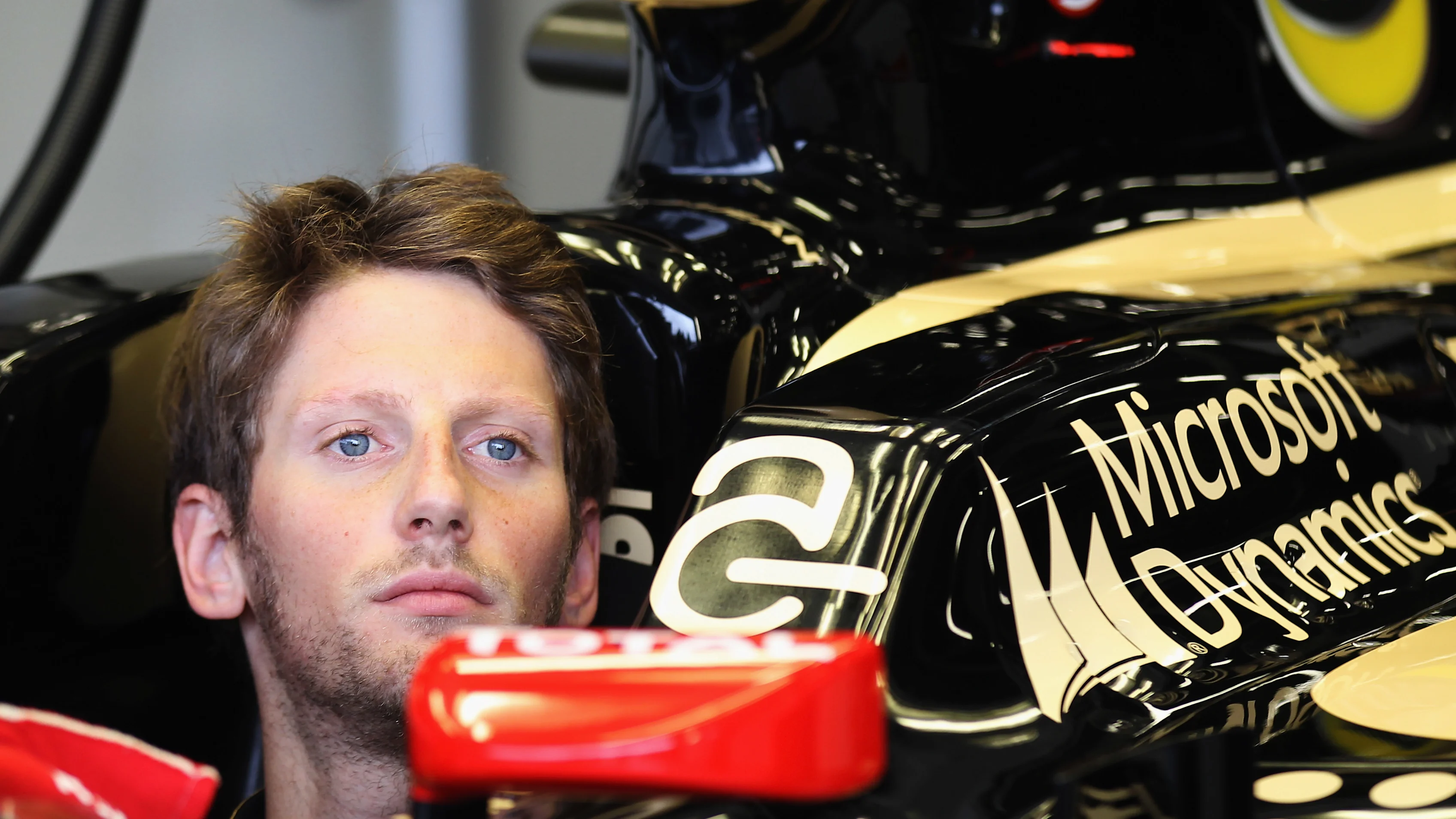 NORTHAMPTON, ENGLAND - JULY 06:  Romain Grosjean of France and Lotus prepares to drive during