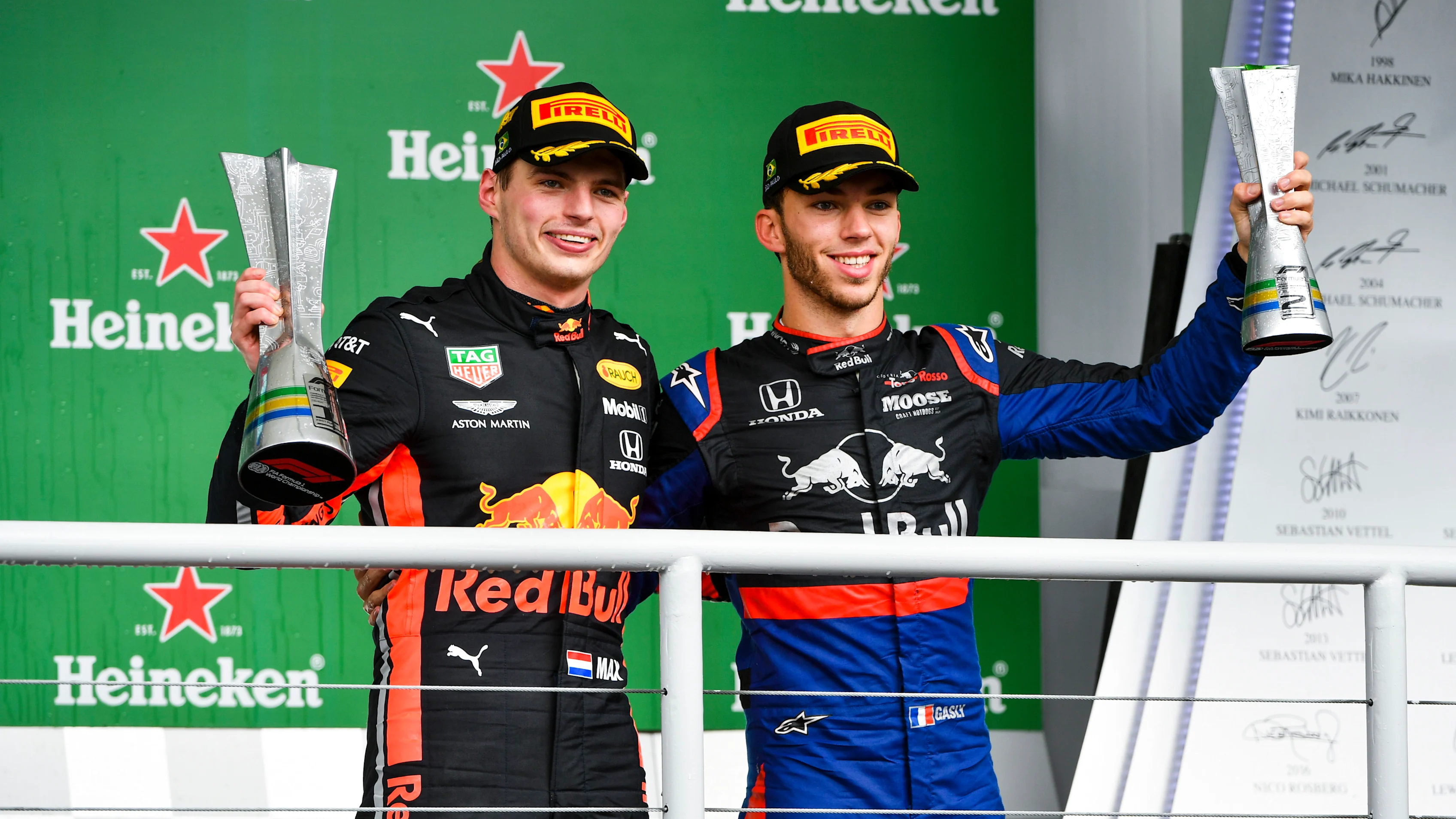 SAO PAULO, BRAZIL - NOVEMBER 17: Race winner Max Verstappen, Red Bull Racing and Pierre Gasly, Toro