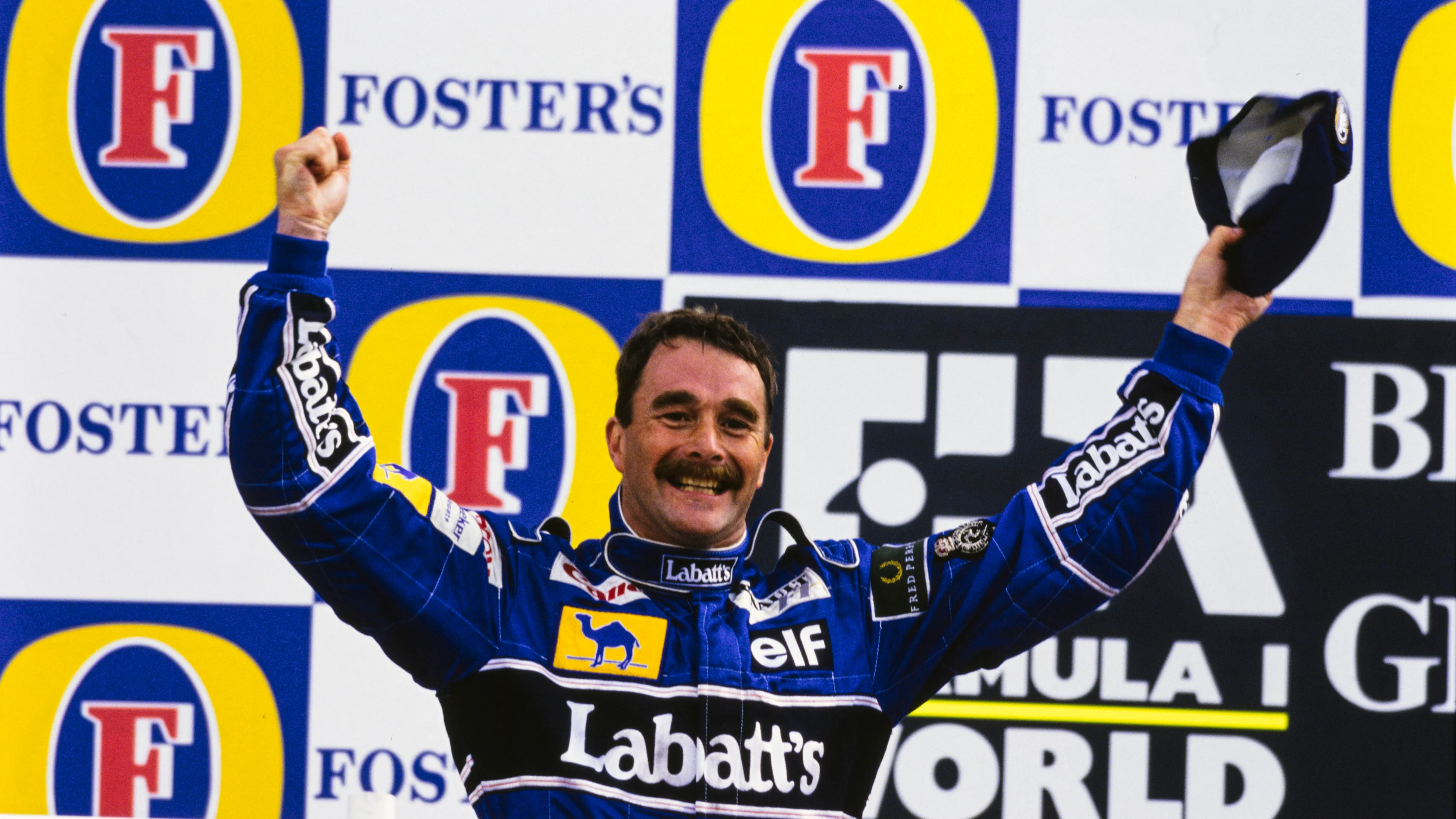 SILVERSTONE, UNITED KINGDOM - JULY 12: Nigel Mansell, 1st position, celebrates on the podium after
