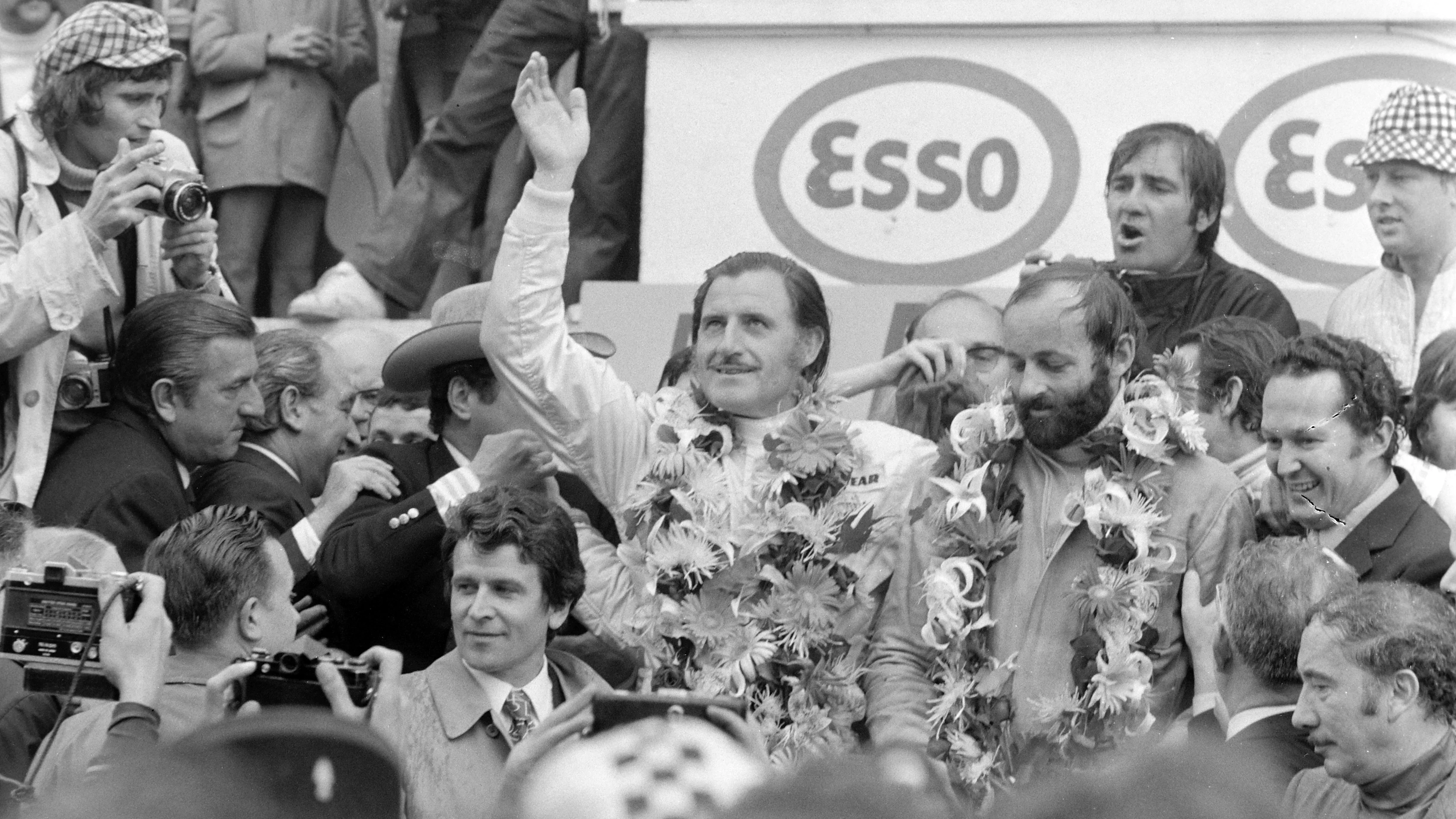 CIRCUIT DE LA SARTHE, FRANCE - JUNE 11: Graham Hill and Henri Pescarolo, 1st position, celebrate on