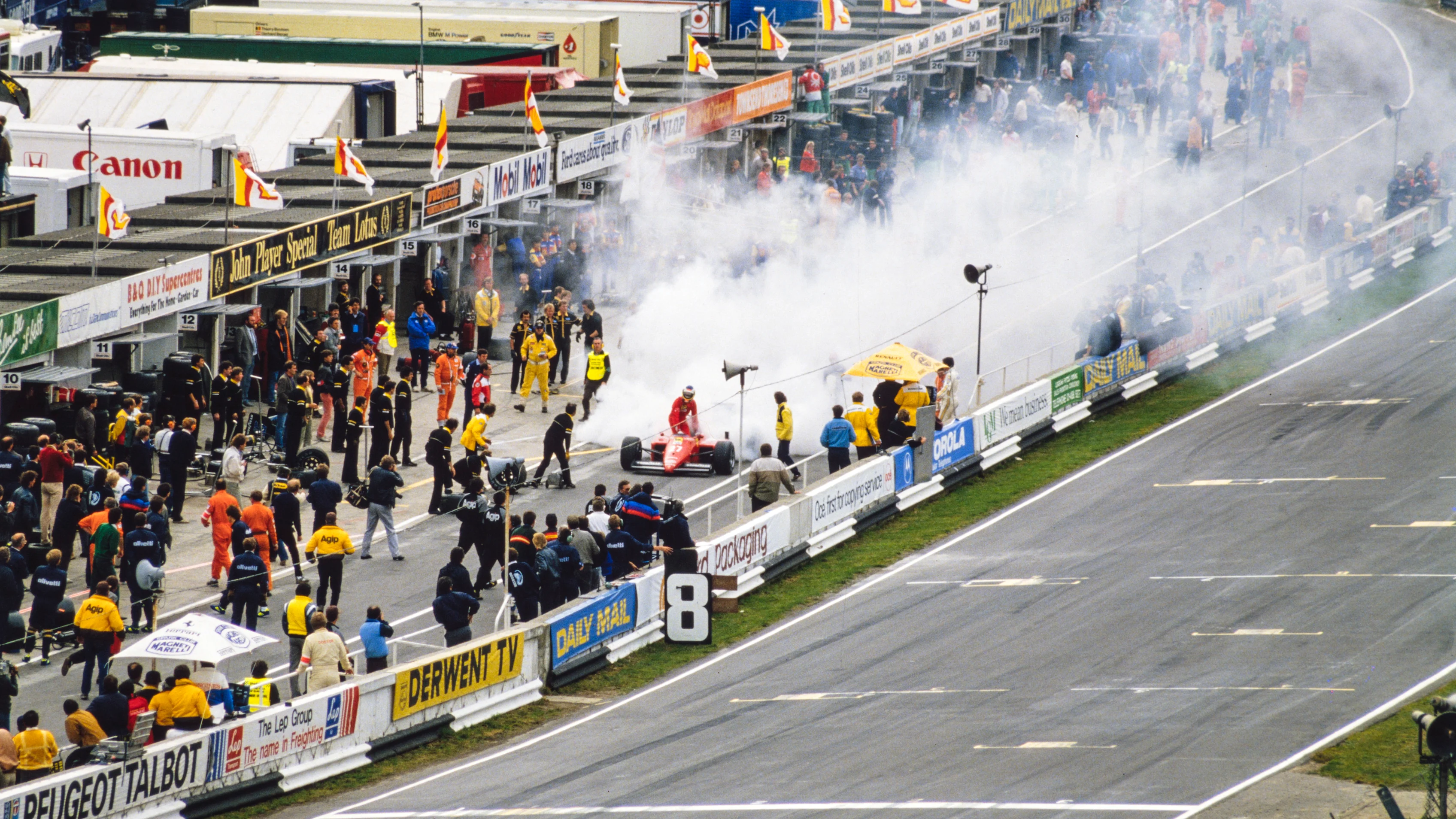 BRANDS HATCH, UNITED KINGDOM - OCTOBER 06: Michele Alboreto prepares to jump out of his Ferrari
