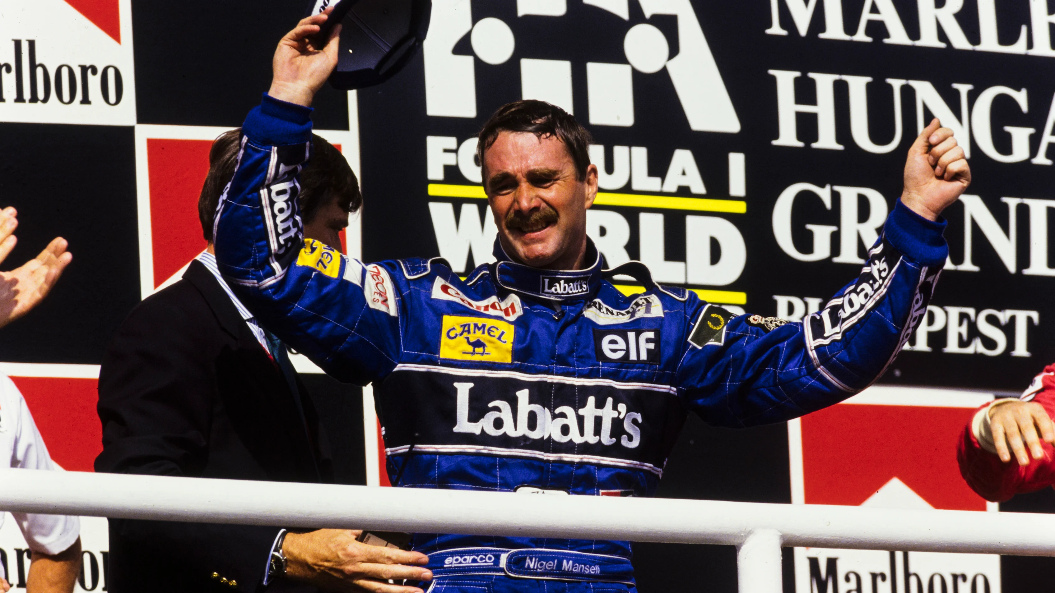 HUNGARORING, HUNGARY - AUGUST 16: Nigel Mansell, 2nd position, celebrates his world championship