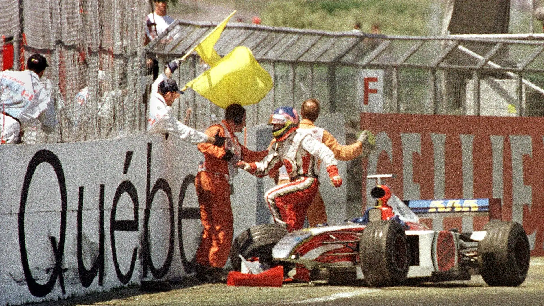 MONTREAL, CANADA: Canadian F-1 driver Jacques Villeneuve jumps out of his car after crashing at