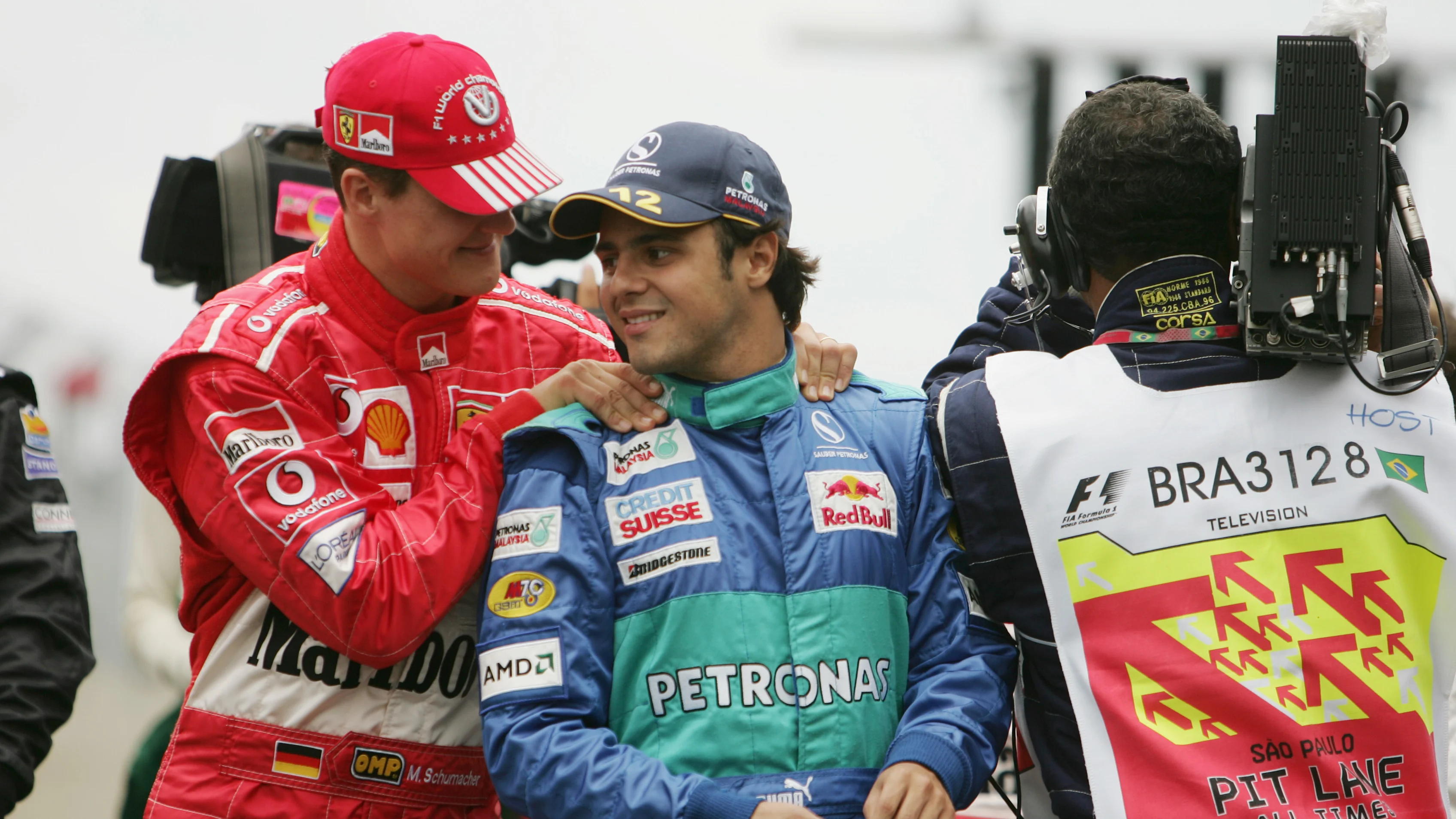 SAO PAULO, BRAZIL - OCTOBER 24:  (L-R) Michael Schumacher of Germany and Ferrari, shares a joke