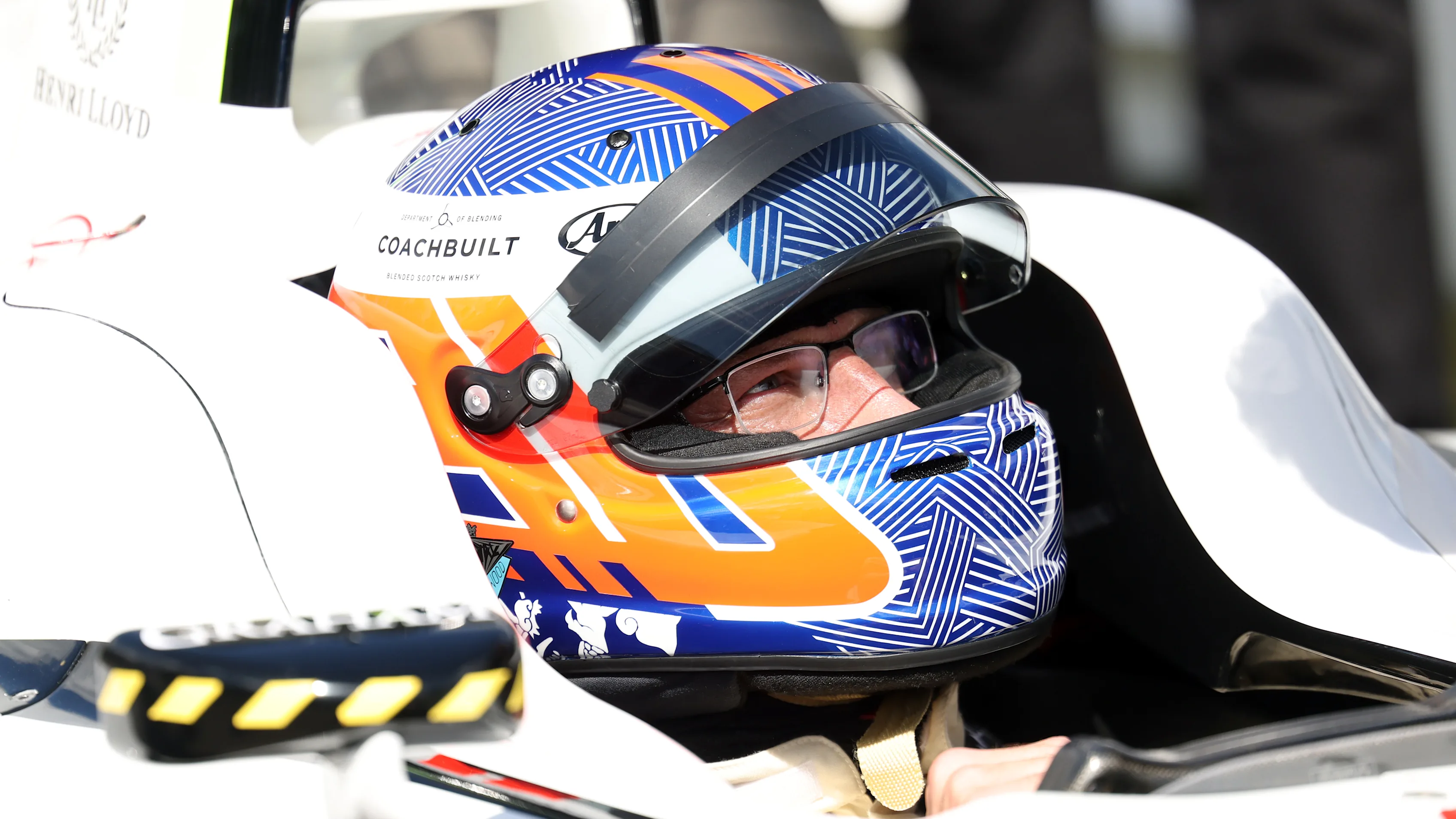 Jenson Button sits in his 2009 Formula 1 World Championship‑winning Brawn BGP 001 before an on