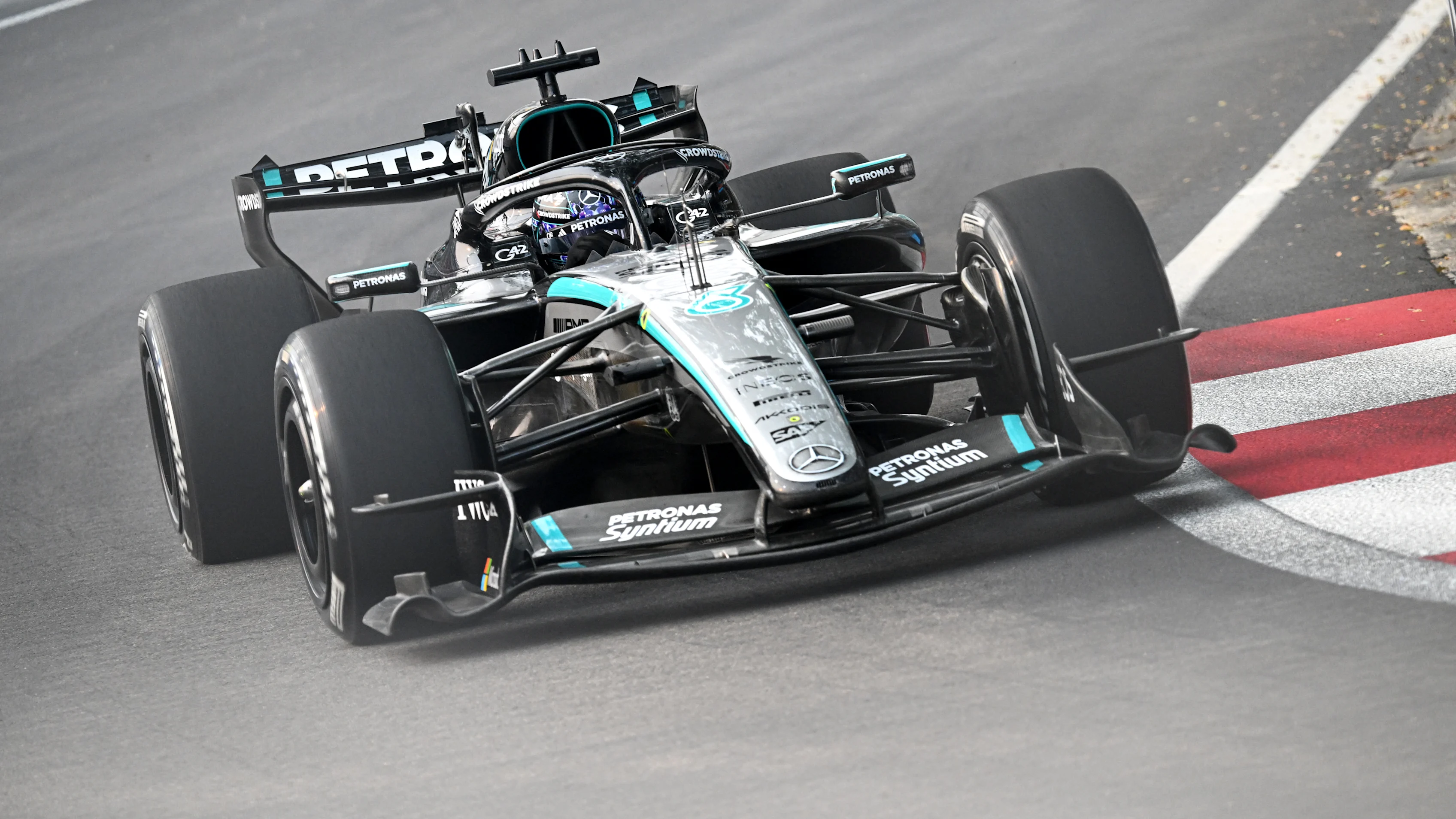 SINGAPORE, SINGAPORE - OCTOBER 09: George Russell of Great Britain driving the (63) Mercedes AMG