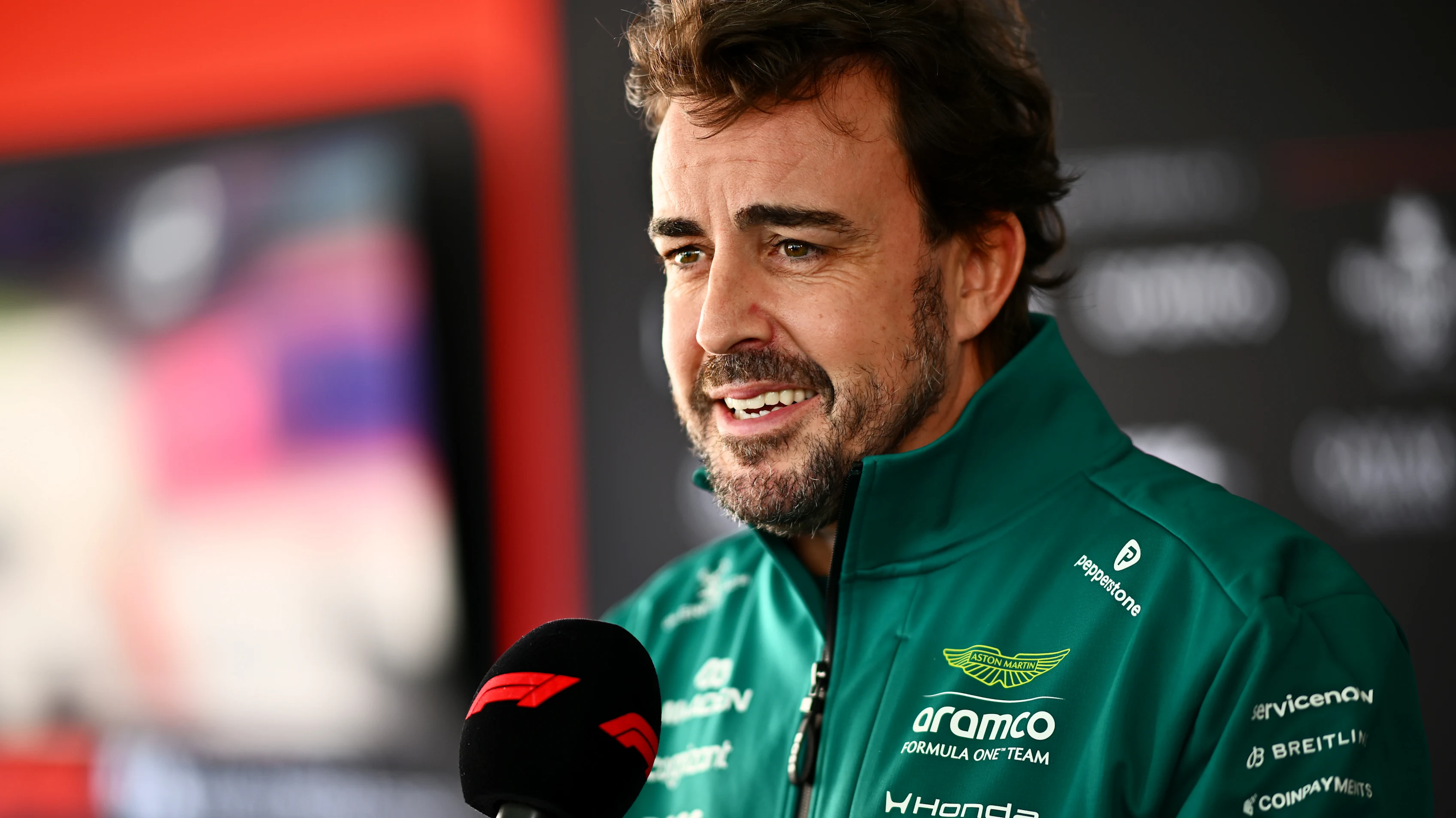 AUSTIN, TEXAS - OCTOBER 22: Fernando Alonso of Spain and Aston Martin F1 Team talks to the media