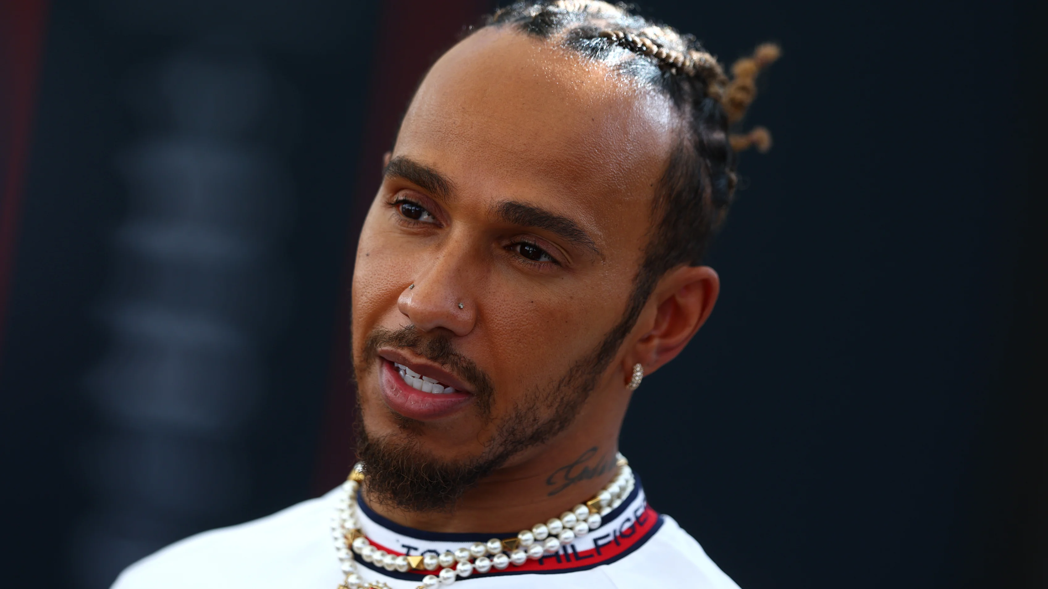 ABU DHABI, UNITED ARAB EMIRATES - NOVEMBER 23: Lewis Hamilton of Great Britain and Mercedes talks