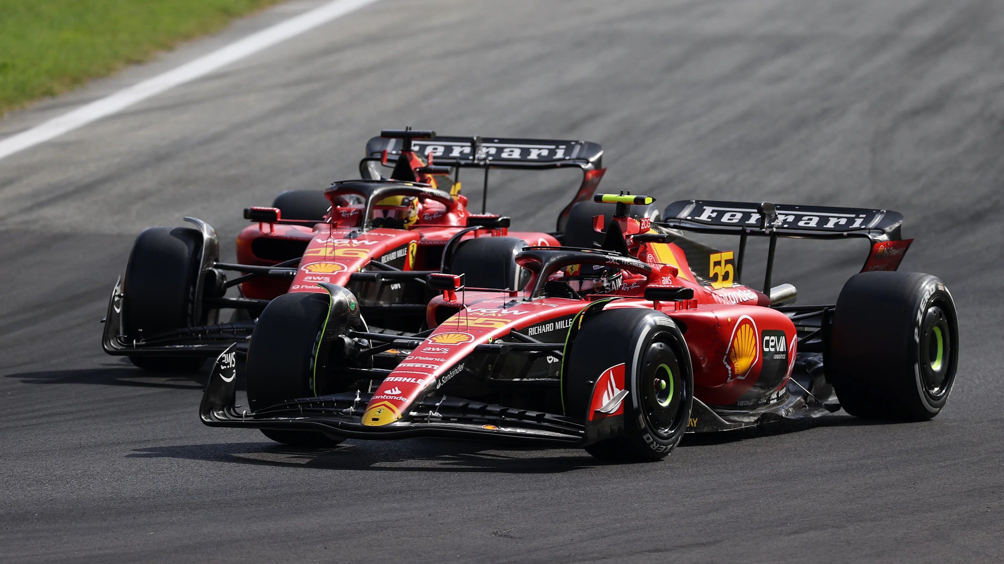 MONZA, ITALY - SEPTEMBER 03: Carlos Sainz of Spain driving (55) the Ferrari SF-23 leads Charles
