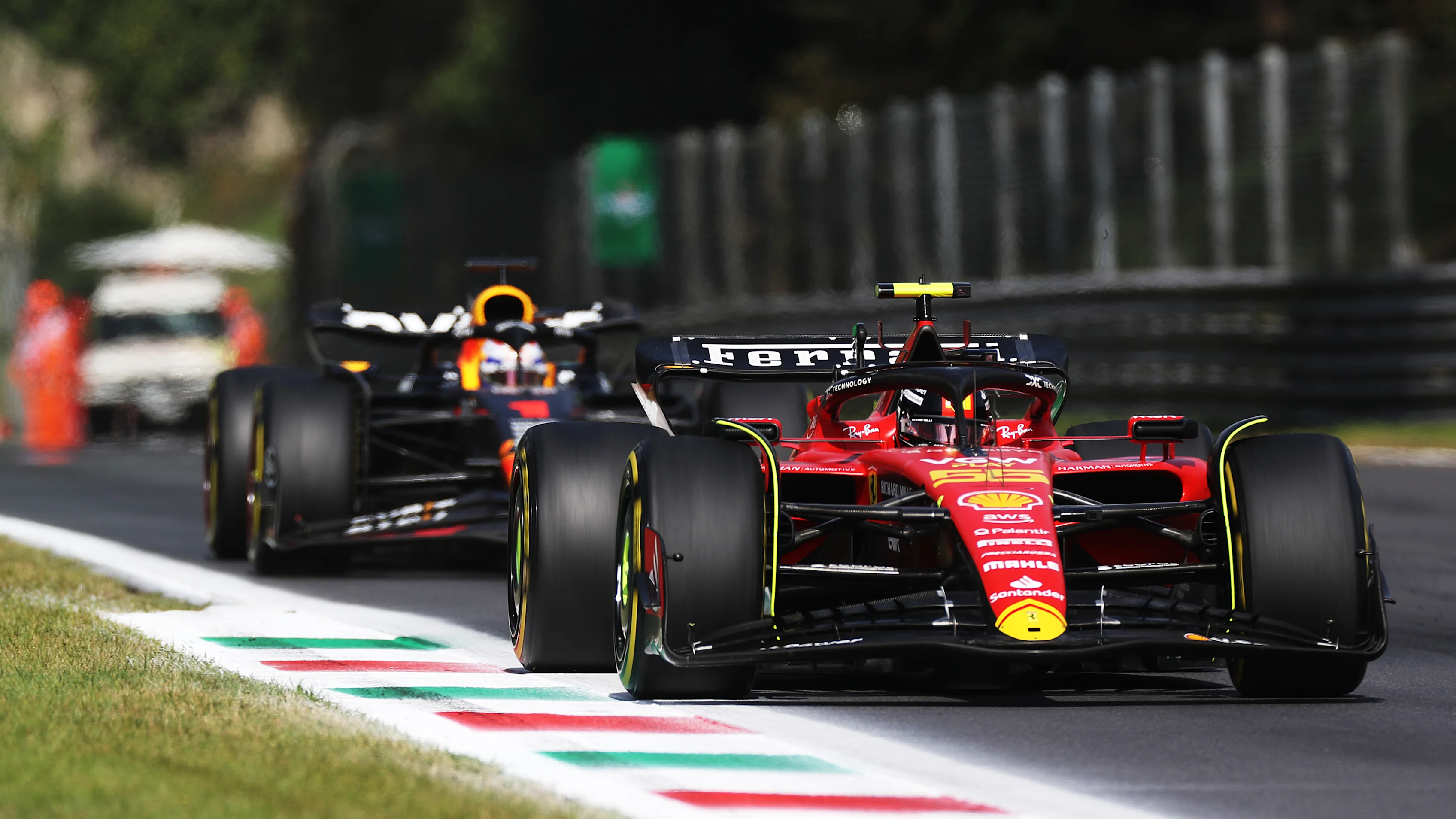 MONZA, ITALY - SEPTEMBER 03: Carlos Sainz of Spain driving (55) the Ferrari SF-23 leads Max