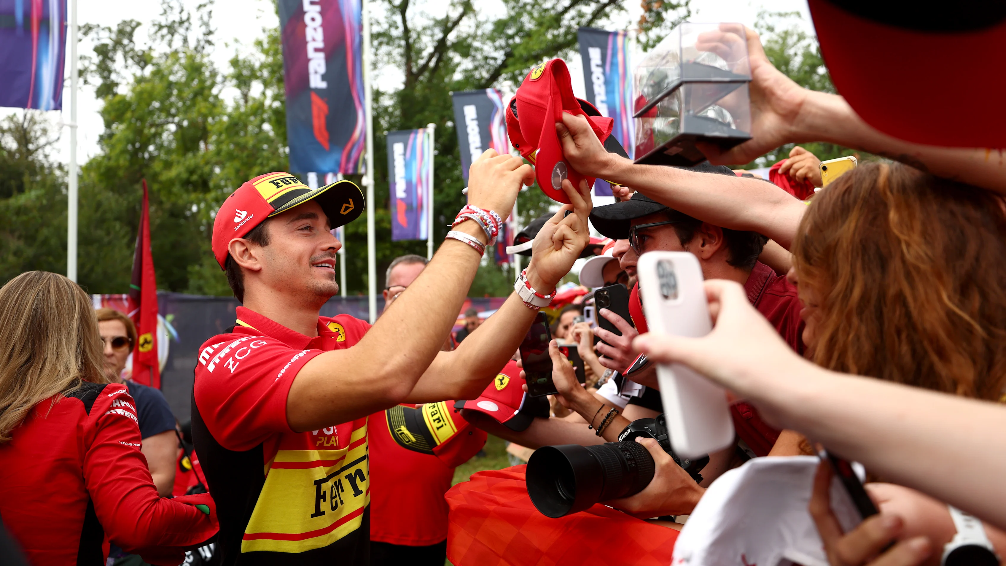 MONZA, ITALY - SEPTEMBER 02: Charles Leclerc of Monaco and Ferrari greets fans at the fan stage