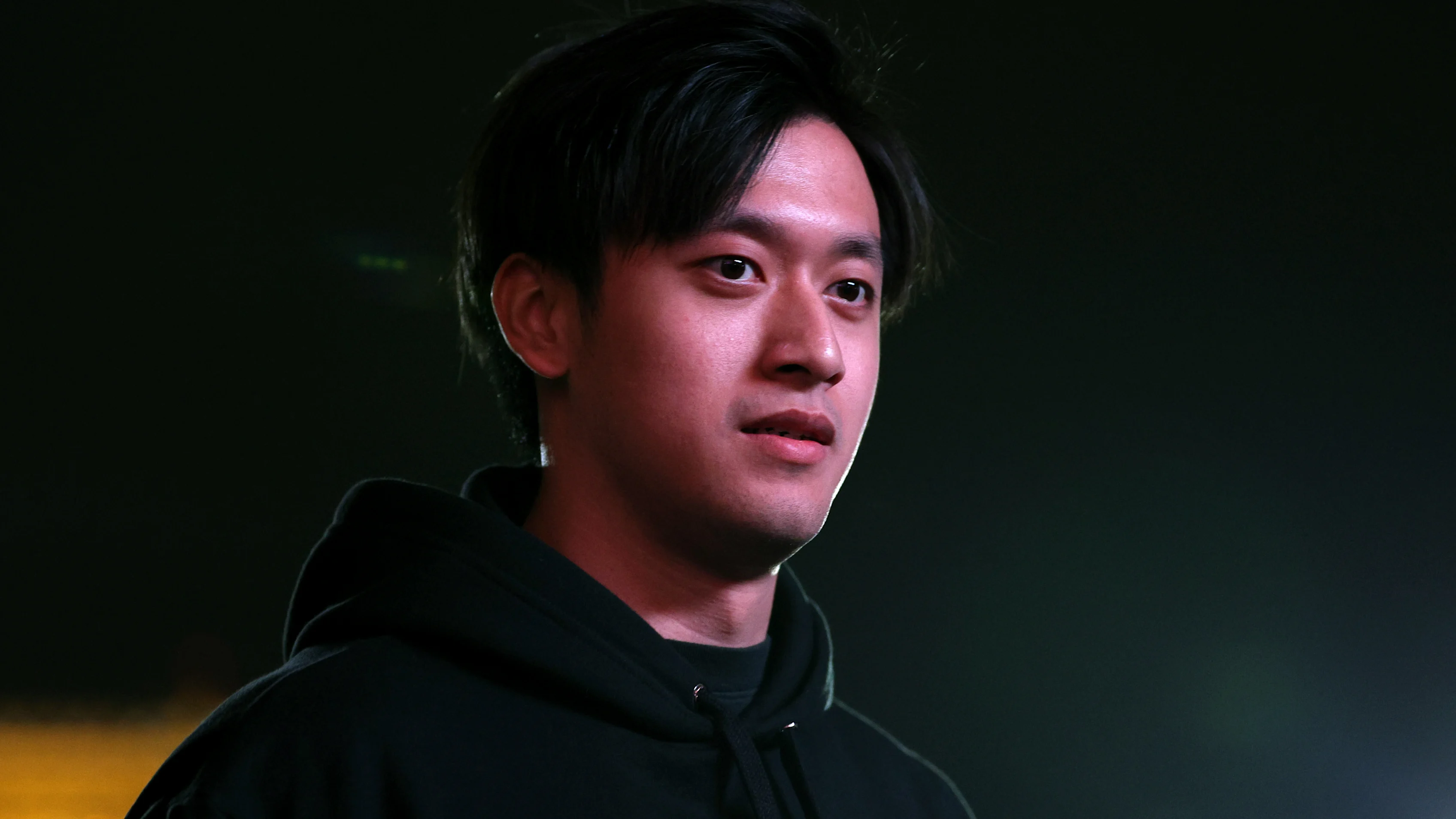 LAS VEGAS, NEVADA - NOVEMBER 15: Zhou Guanyu of China and Alfa Romeo F1 walks in the Paddock during