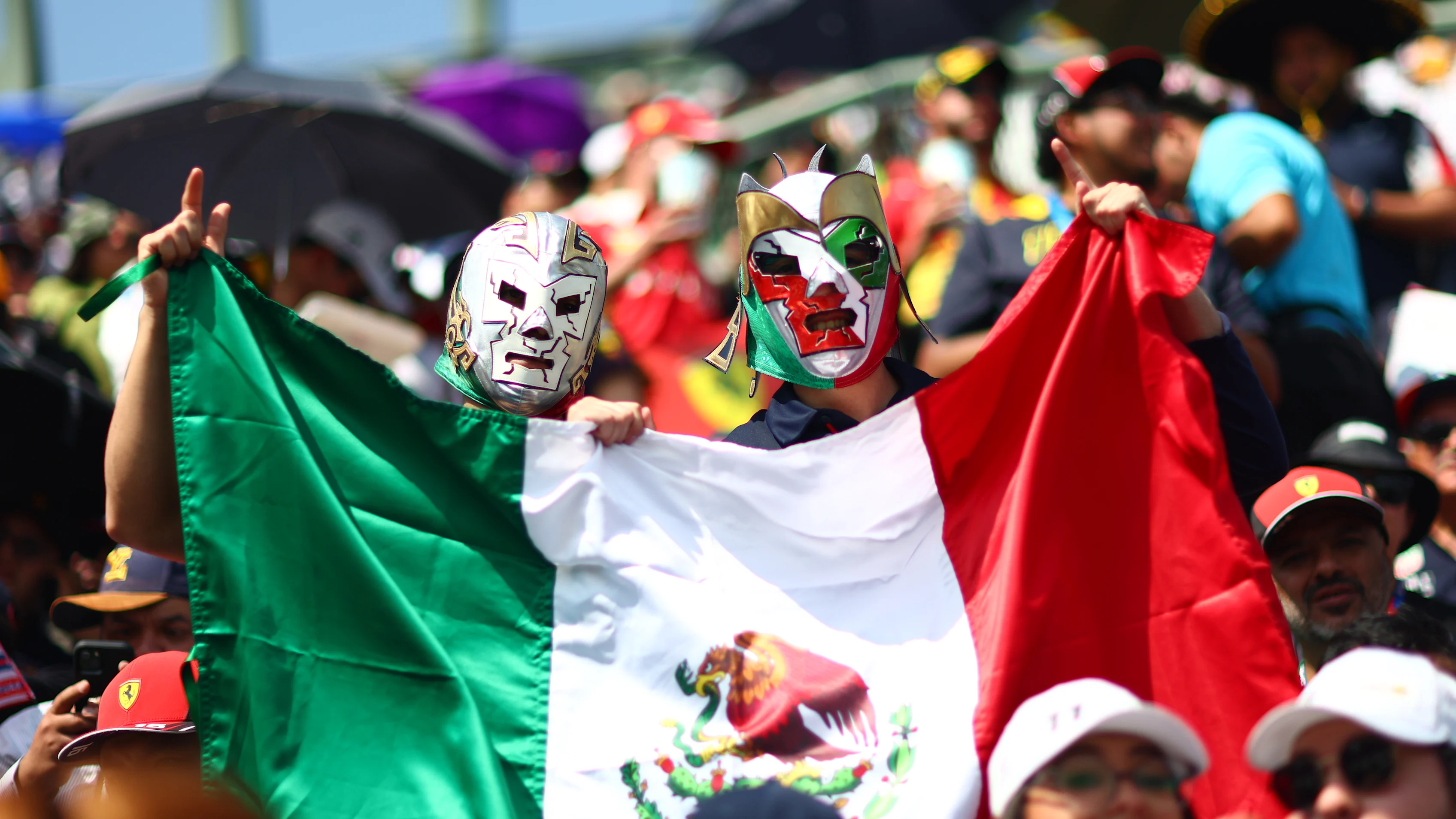 MEXICO CITY, MEXICO - OCTOBER 29: Sergio Perez of Mexico and Oracle Red Bull Racing fans watch the