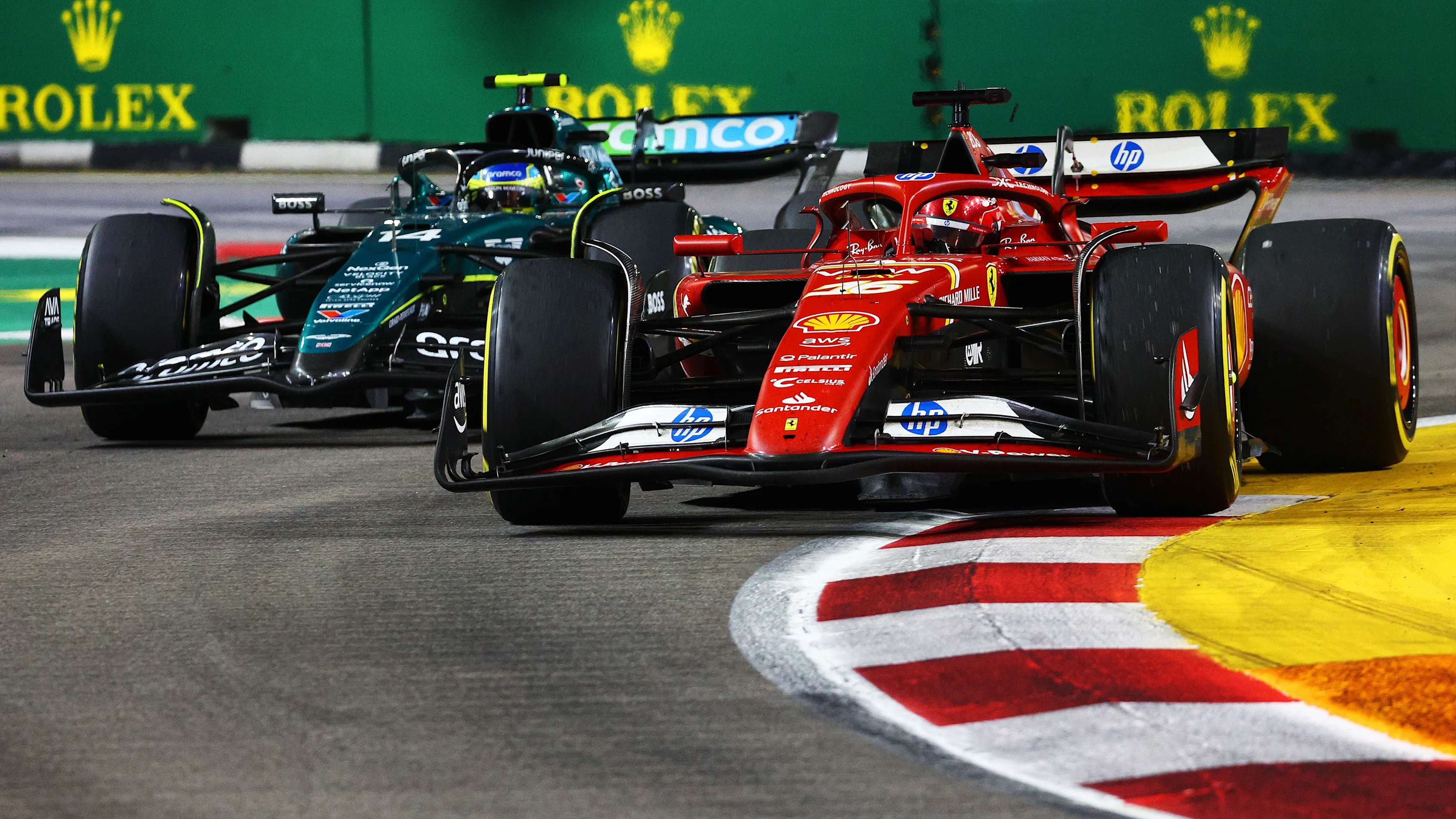 SINGAPORE, SINGAPORE - SEPTEMBER 22: Charles Leclerc of Monaco driving the (16) Ferrari SF-24 leads