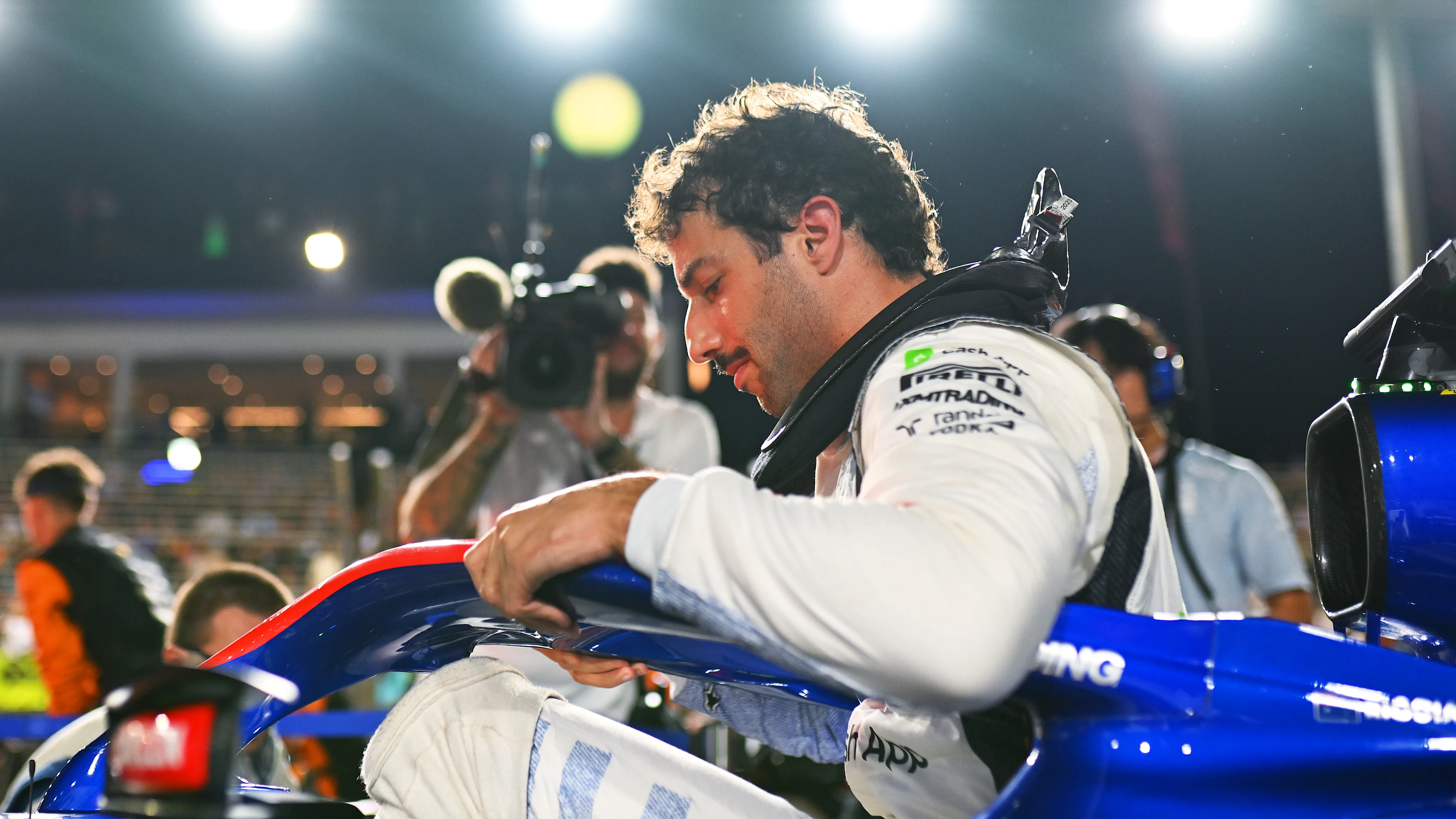 SINGAPORE, SINGAPORE - SEPTEMBER 22: Daniel Ricciardo of Australia and Visa Cash App RB on the grid