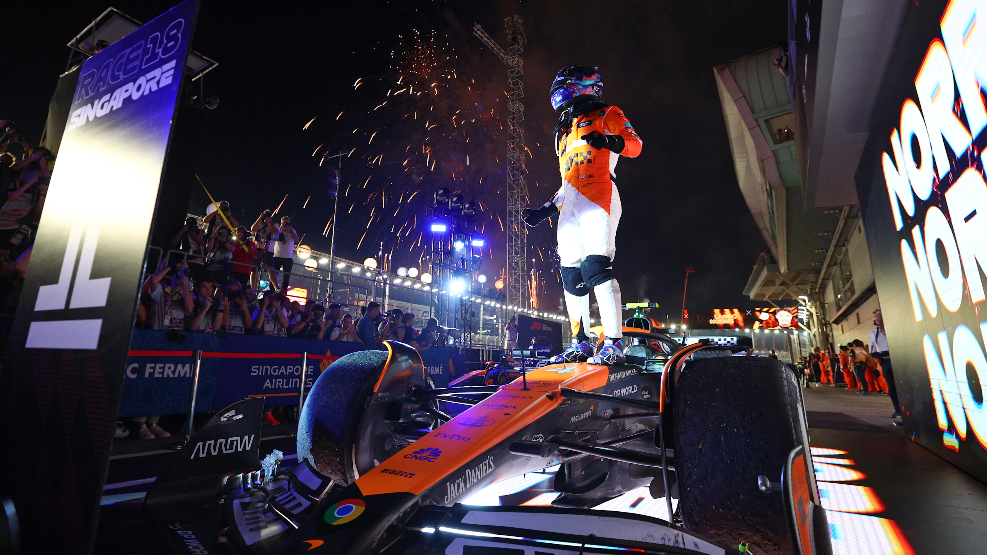 SINGAPORE, SINGAPORE - SEPTEMBER 22: Race winner Lando Norris of Great Britain and McLaren