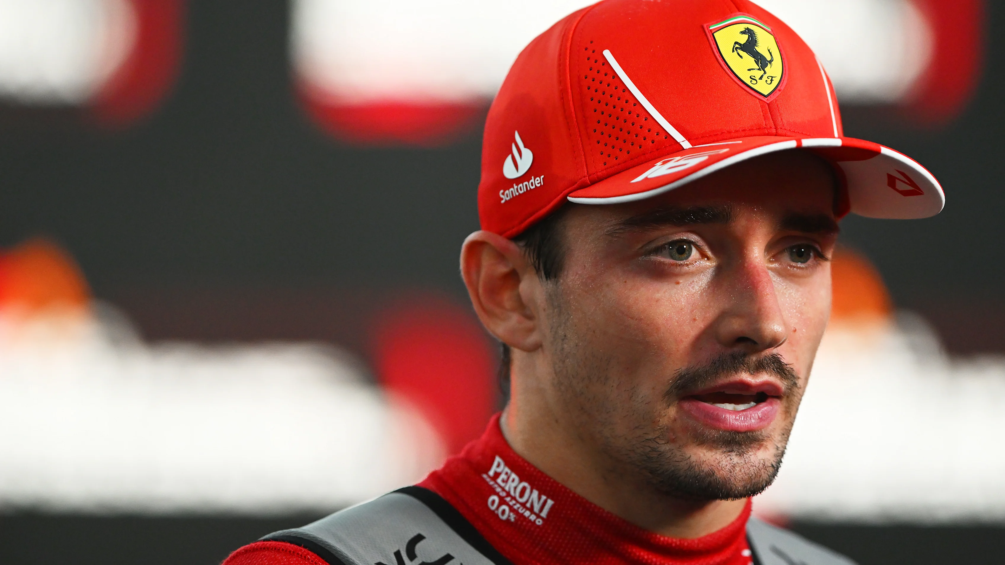 SINGAPORE, SINGAPORE - SEPTEMBER 22: 5th placed Charles Leclerc of Monaco and Ferrari speaks to the
