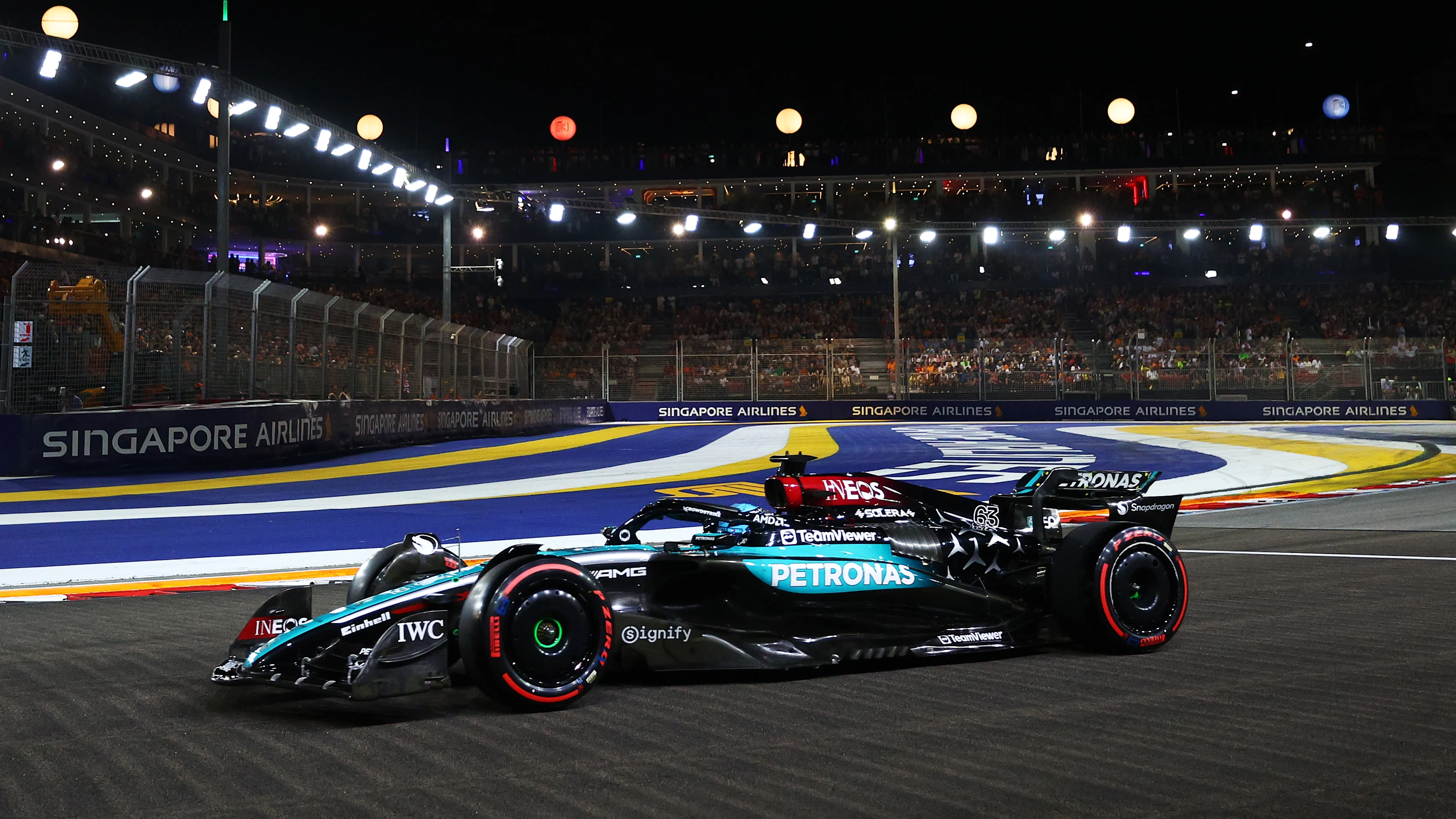 SINGAPORE, SINGAPORE - SEPTEMBER 21: George Russell of Great Britain driving the (63) Mercedes AMG