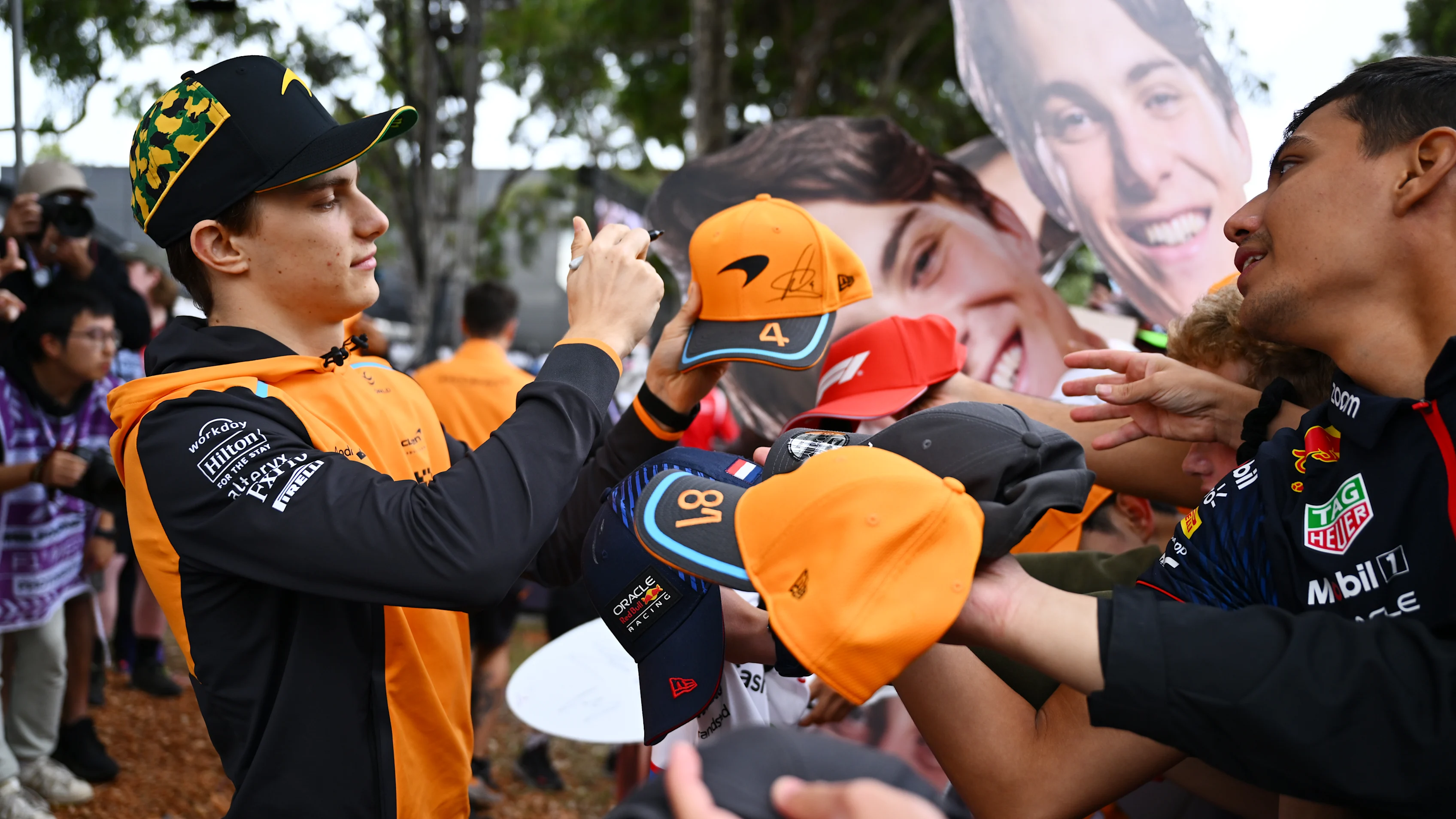 MELBOURNE, AUSTRALIA - MARCH 24: Oscar Piastri of Australia and McLaren greets fans on the